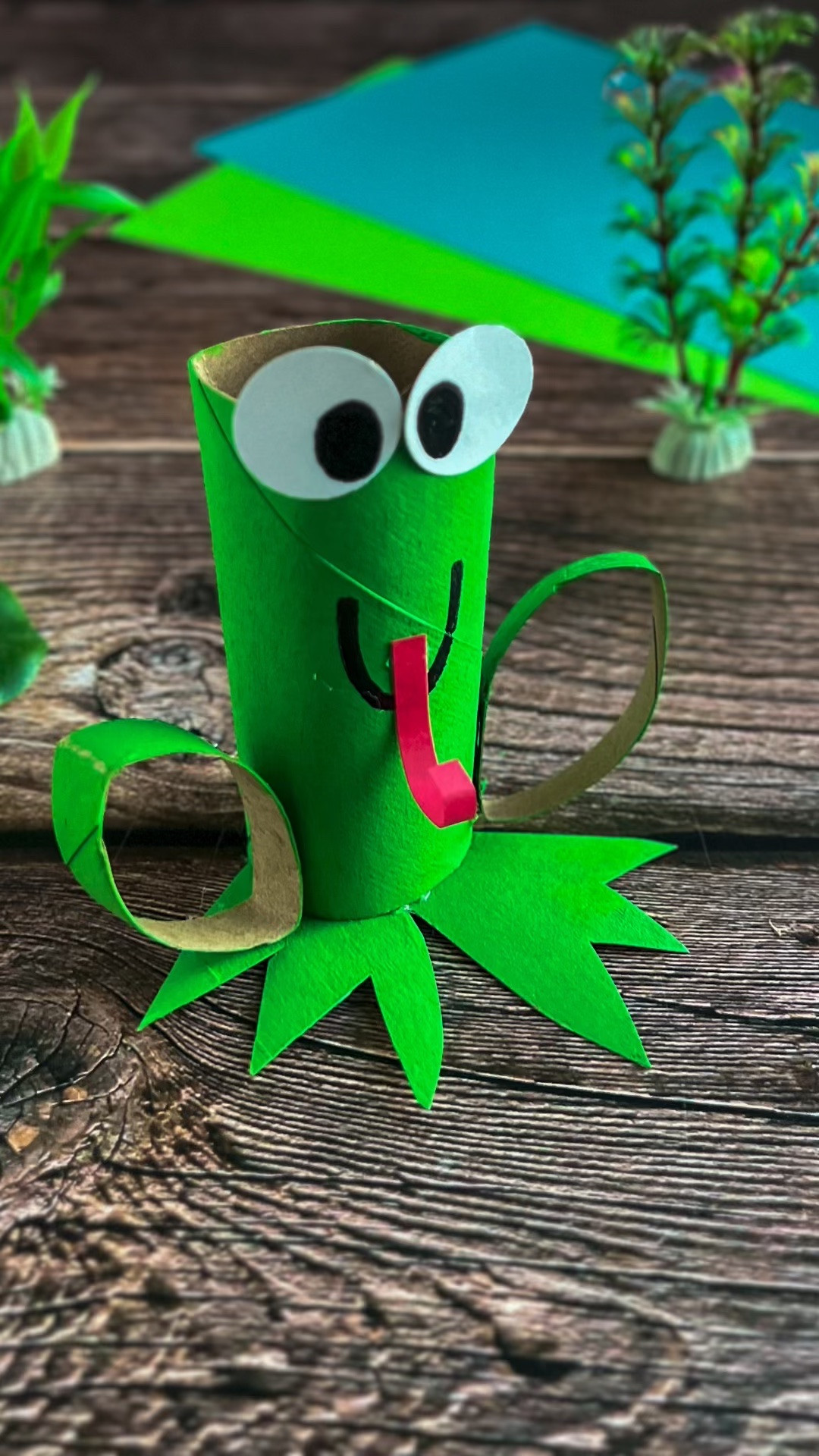 Turn an everyday cardboard tube into the cutest jumping frog craft!