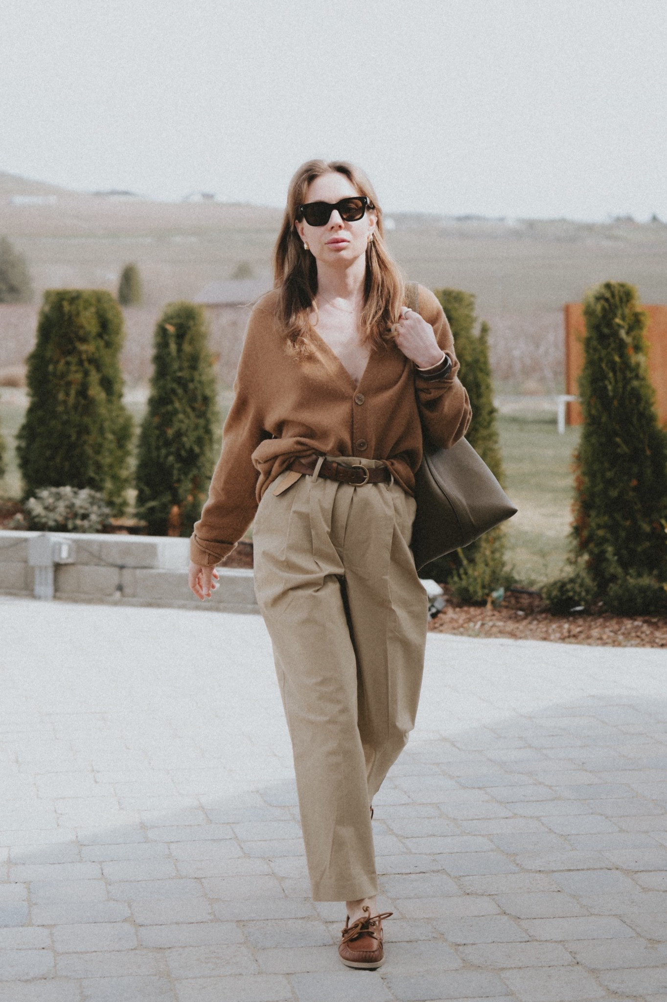 @SEZANE Romain pants + Golden Goose boat shoes + @guestinresidence cardigan + Buck Mason belt + Toteme belted tote. 

#LTKSeasonal #LTKootd
