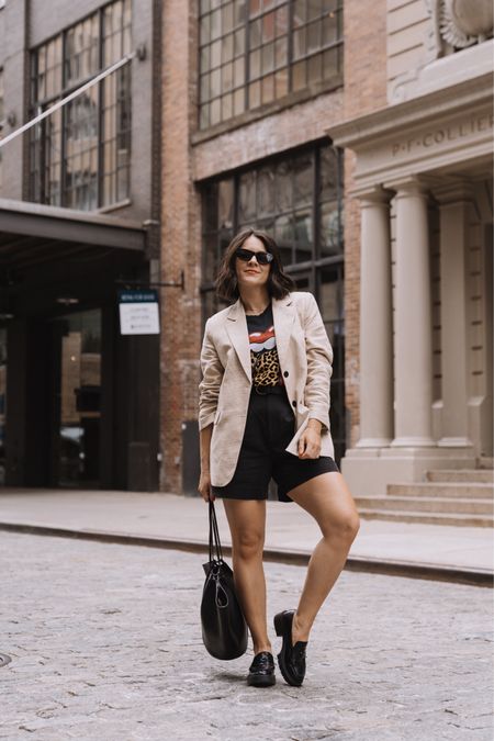 Casual spring transition outfit. How to style black Everlane shorts. Loafers. Oversized blazer graphic tee 

#LTKstyletip #LTKfindsunder100 #LTKfindsunder50