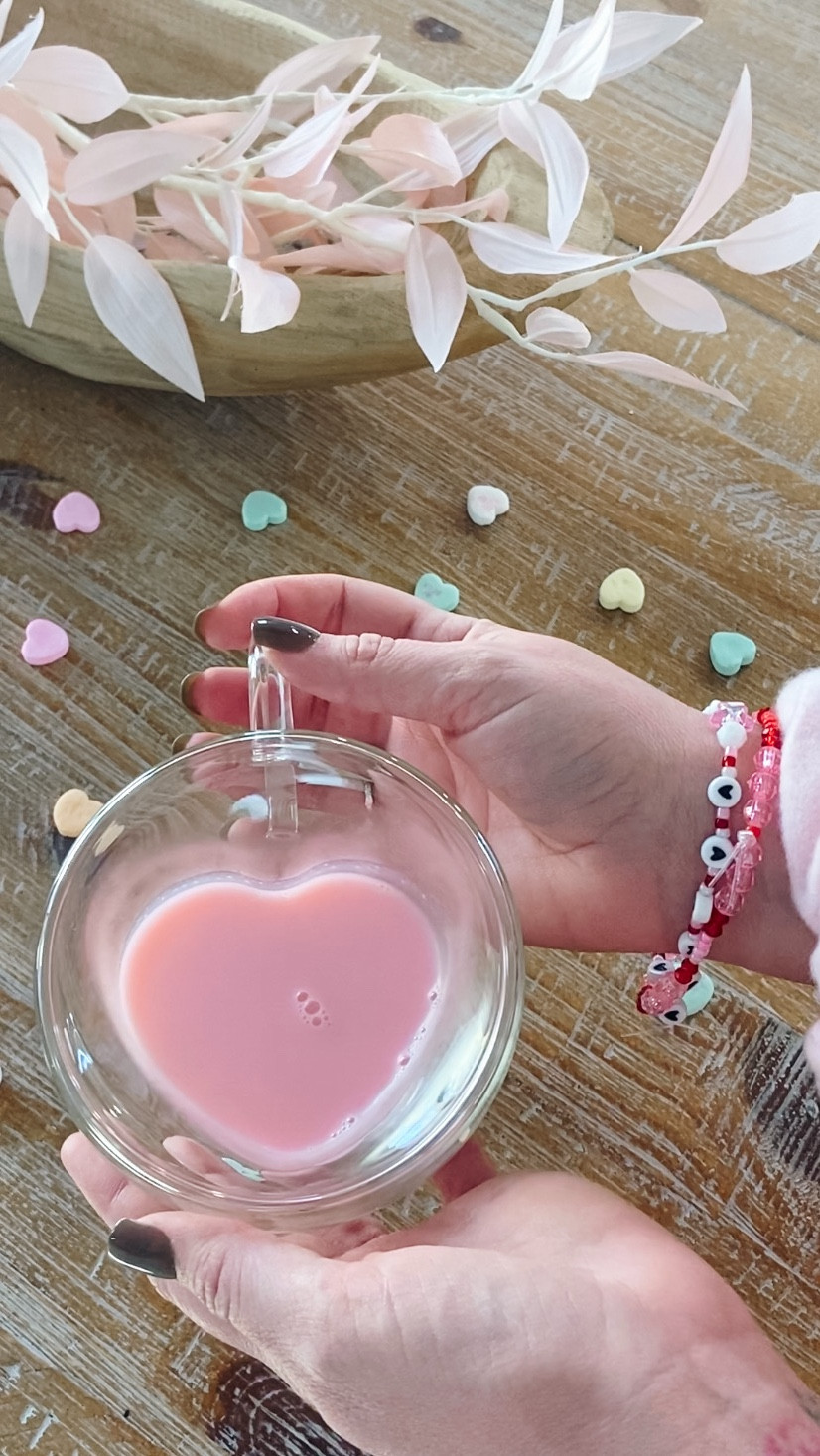 Save this! 💕PINK Hot Chocolate perfect as a Valentine’s Day treat! This cute drink not only looks cute, but it tastes incredible! See recipe below ⬇️

Strawberry Pink Hot Chocolate 🍓💕
* ¼ a cup of Sugar
* 6 cubes of Baker's White Chocolate
* 2 pinches of Salt 
* ¼ a cup of Hot Water
* 3 Cups of Strawberry Milk
* 1 teaspoon of Vanilla
* 2 drops of Pink Food Coloring
* Whip Cream for topping
* Sprinkles for topping

Add chocolate, salt, and water to a sauce pan. Stir on medium heat until well combined. Add strawberry milk and vanilla. Bring to boil, stirring frequently and then remove from heat. Add in food coloring, stir, and serve! 💕



#LTKmomlife #LTKSeasonal #LTKKids