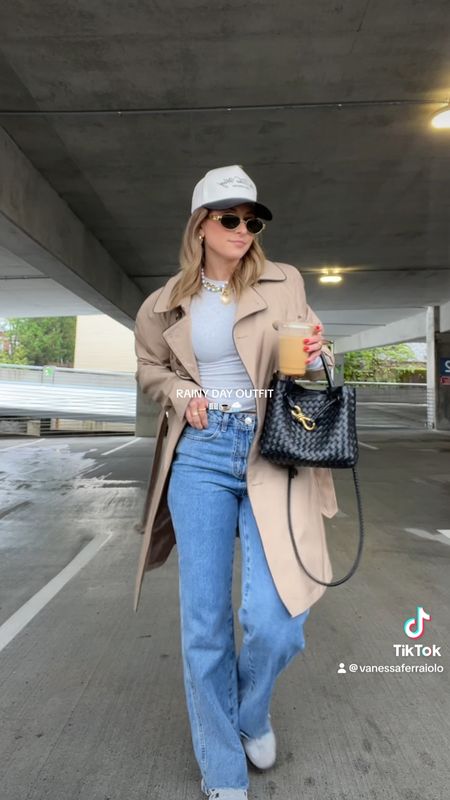 5/5/24 Rainy day outfit 🫶🏼 trench coat, trench coat outfit, Princess Polly jeans, dark wash denim, wide leg jeans, skims basics, skims long sleeve, skims tops, trucker hat outfit