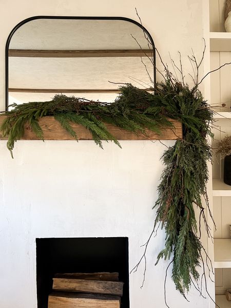 my 2023 natural + organic holiday mantel garland - i layered cedar garland & pine then filled with stems, willow branches, little brown berry stems, & slightly frosted pinecone branches 

#LTKHoliday #LTKhome #LTKfindsunder50