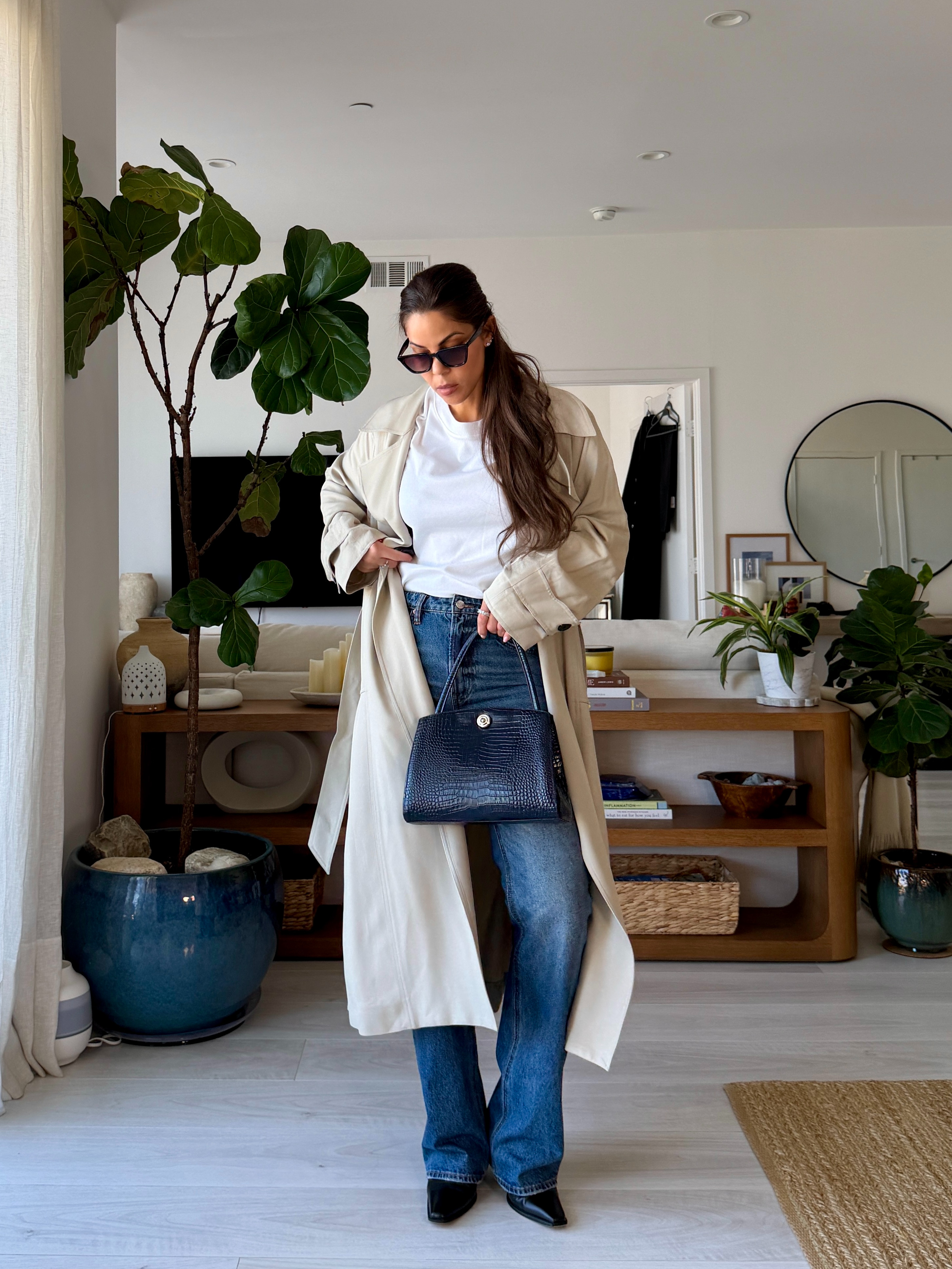The kind of outfit you can wear on repeat all season 🤍
Bootcut denim, a crisp white tee, a classic trench, and a leather bag—simple pieces styled with intention for that effortless, elevated everyday look. 

 #LTKgrwm #LTKootd #LTKTall