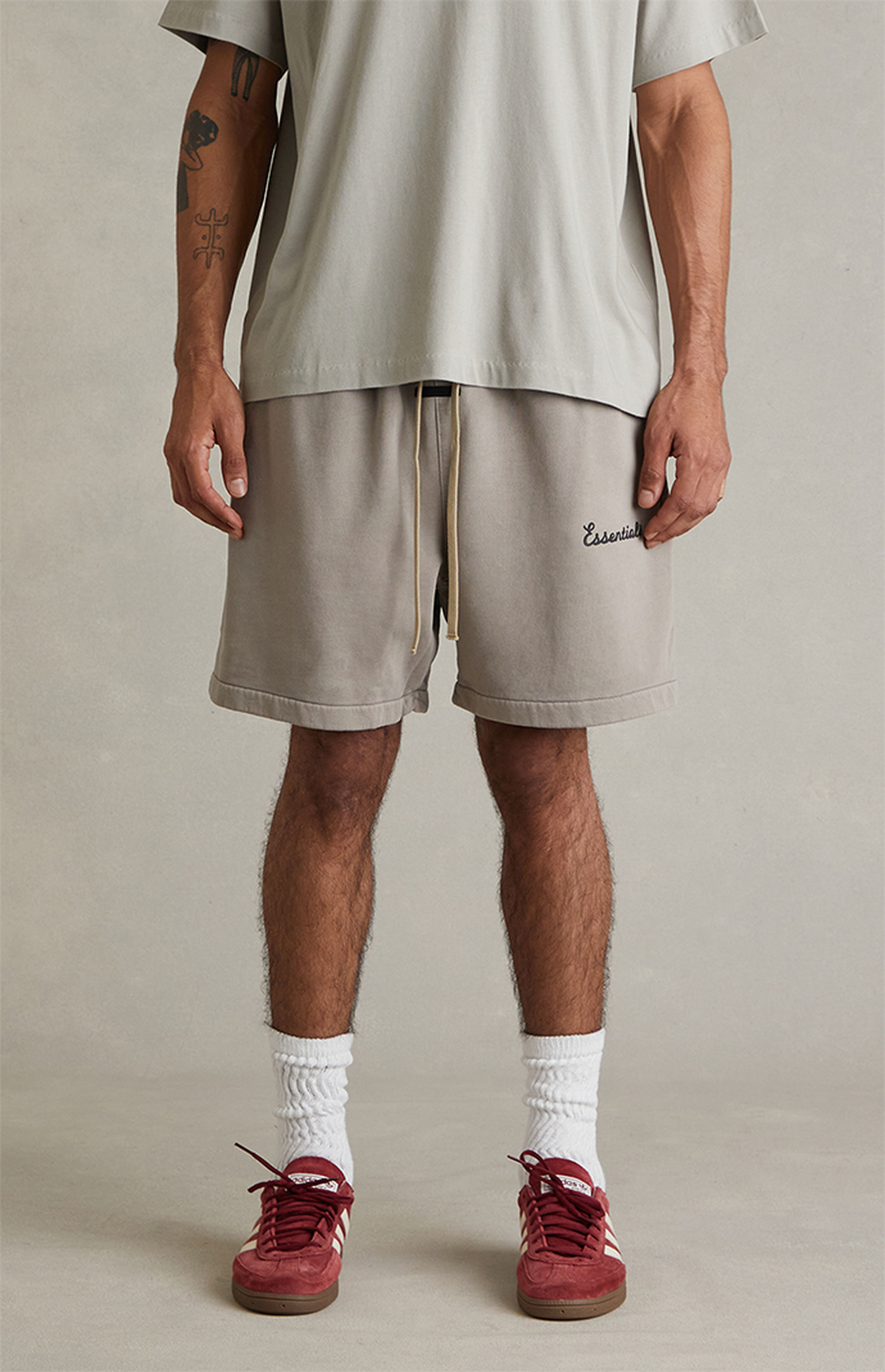 Fear of God ESSENTIALS Faded Seal Training Classic Fit Sweat Shorts | PacSun