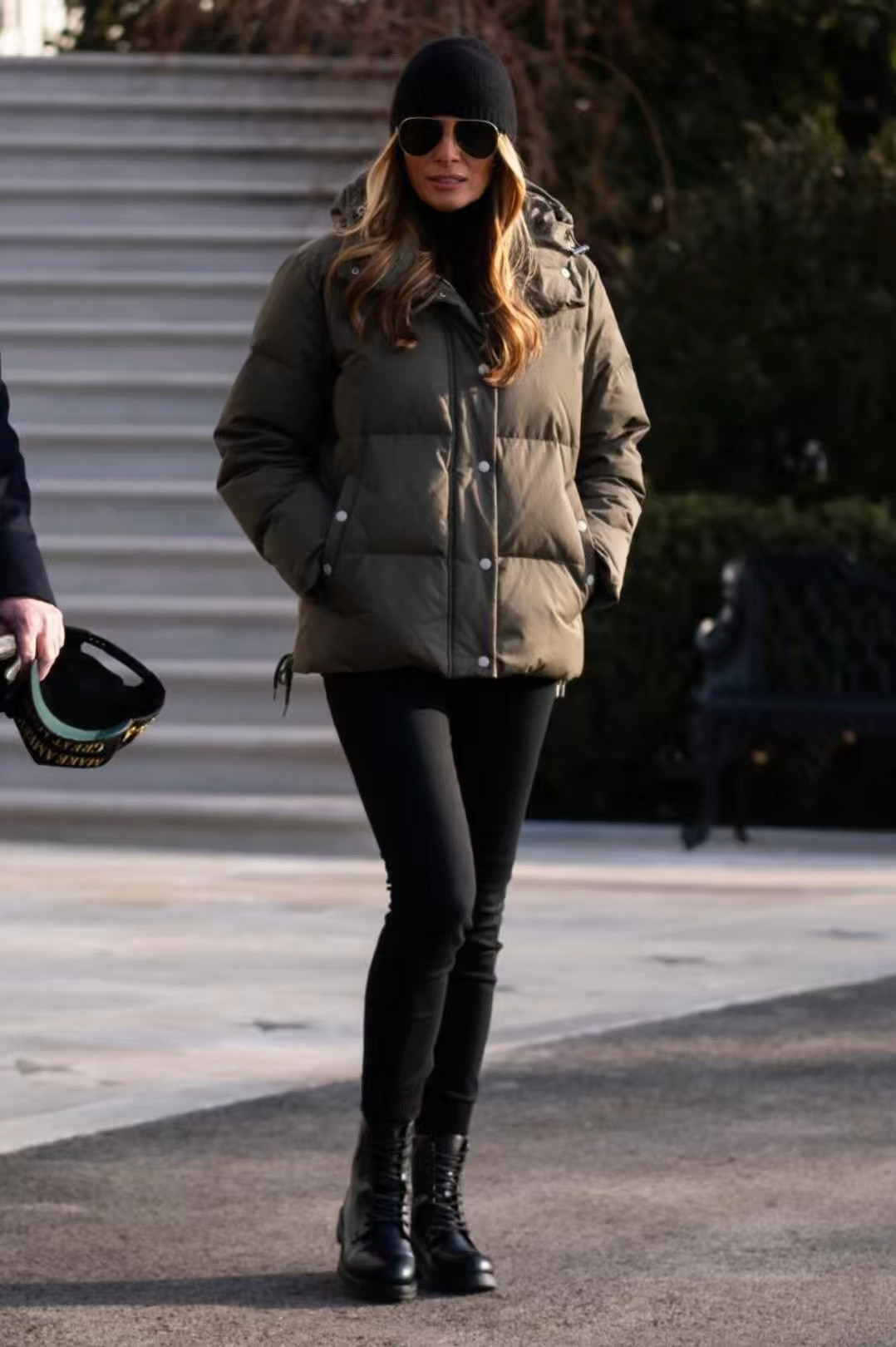 Who designed First lady #MelaniaTrump green quilted puffer jacket with lace-up side seam detailing, her belted khaki safari jacket, oversized aviator sunglasses, lace up leather combat boots black skinny jeans and knit beanie?


#melaniatrumpstyle
#melaniatrumpfashion

#melaniatrumpoutfits
 #flotus



#LTKStyleTip