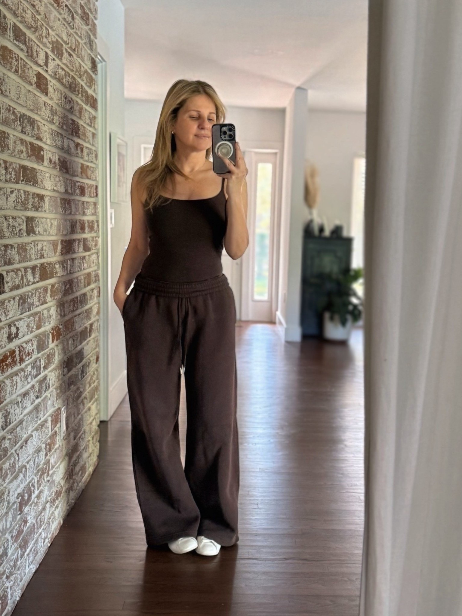 Wearing a matching espresso brown athleisure set from @abercrombie on top is the 90s bra free spaghetti strap tank (size: XS) and the high waist wide leg Sunday sweatpants (size: S) *so soft + comfy 🧸 sneakers are @adidas Lo Pro in white leather.

#LTKootd #LTKSaleAlert #LTKActive