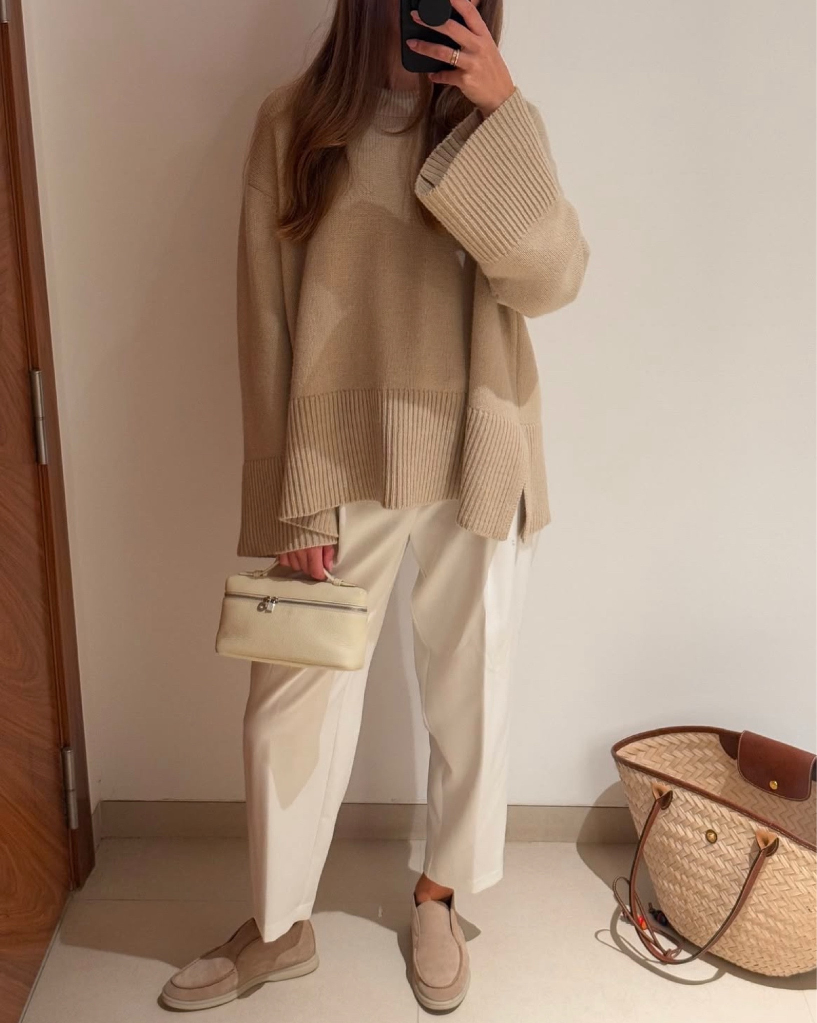 Holiday travel wear in neutral tan beige and cream, wearing Le Sablons beige knit from Rosaé Paris and Loro Piana cream bag and suede loafers (similar linked below)

#LTKstyletip #LTKtravel
