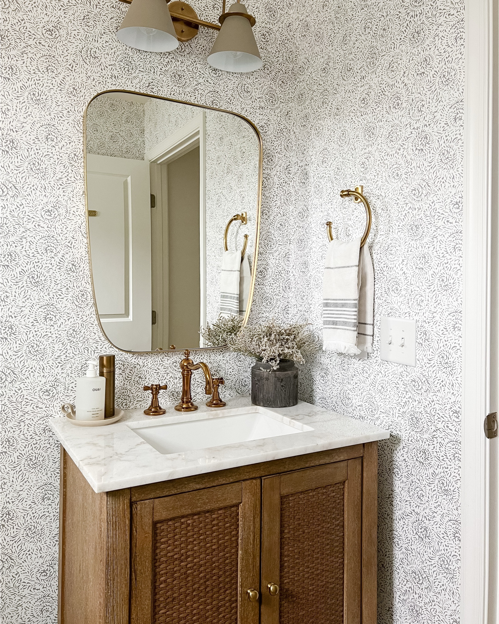 “Small powder room, big personality. 🤍
I leaned into warm brass, natural wood tones, and a soft patterned wallpaper to make this little space feel layered and cozy. It’s proof you don’t need a huge room to create a moment in your home. All the details are linked here on LTK!


#LTKHome #LTKselfcare #LTKSpringSale