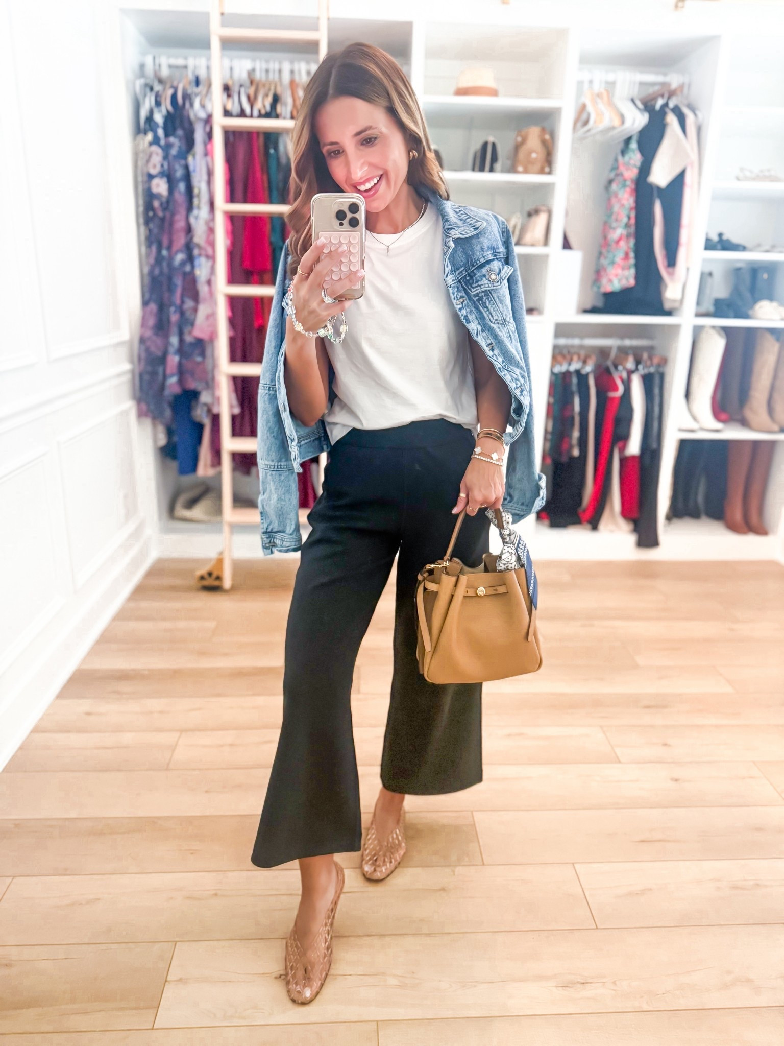 Travel outfit. Elevated casual. I just love these new wide leg modal blend pants! Wearing XXS and has 25” inseam. So soft and comfortable for travel, everyday, and the office, too. The best white t-shirt in XS. XS in denim jacket. Jelly ballet flats are TTS. Tory Burch Romy Bucket bag. 

#LTKTravel #LTKPetite #LTKootd