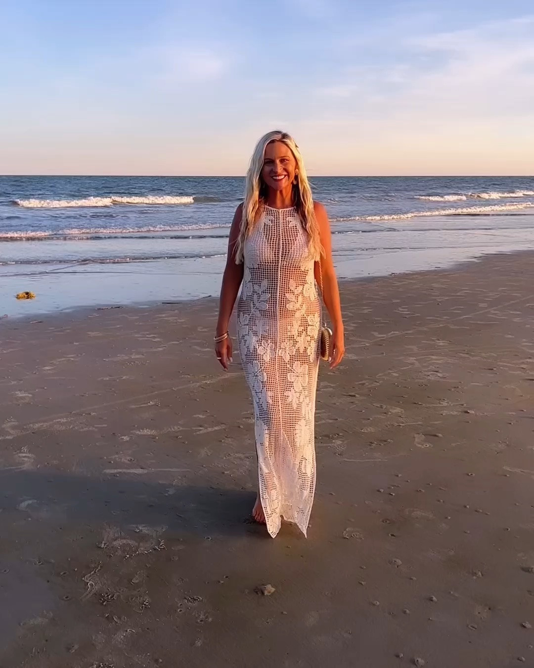 I couldn’t keep this one to photos only. The movement of this crochet cover-up is even prettier in motion, and the soft knit feels like a dream. The kind of effortless coastal elegance that looks even better in person! The open-back detail is stunning, and paired with this gold shell purse, it instantly elevates the entire look. 🐚✨

#LTKootd #LTKSwim #LTKTravel