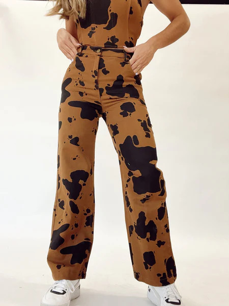 Step Into This Cow Print Pants | Lane 201 Boutique