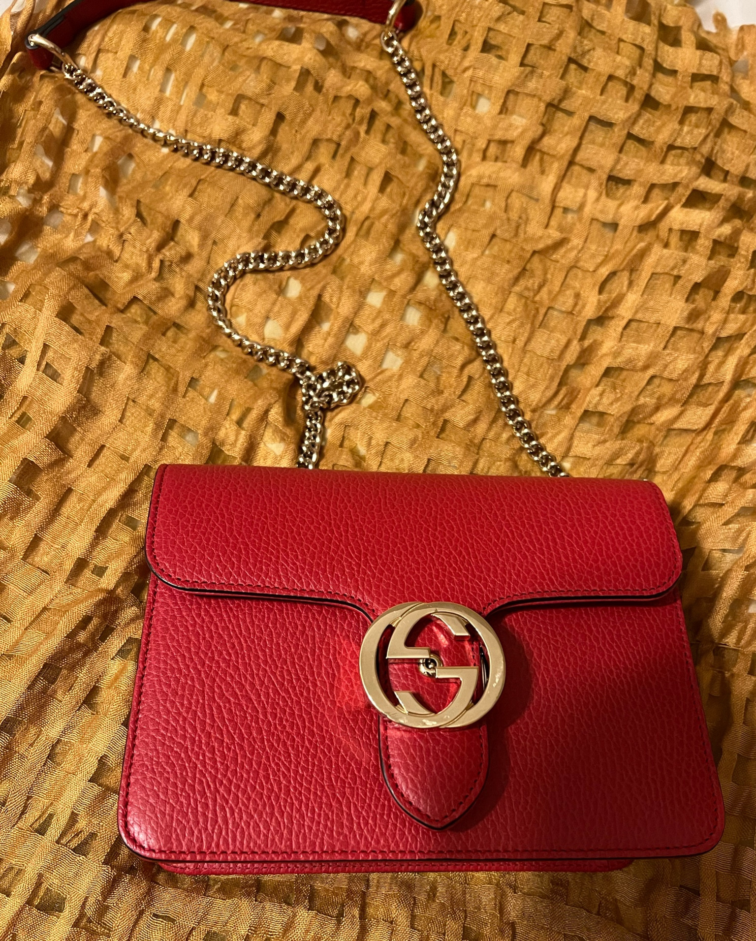 Red interlocking Gucci Purse with gold chain. I love this bag for a pop of color.  

#LTKstyletip #LTKitbag