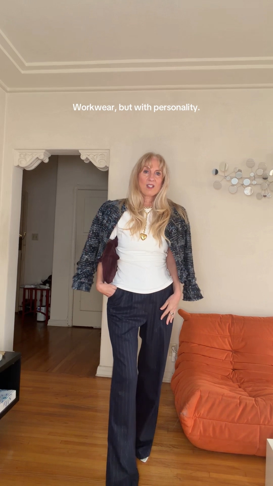 Work outfit. Fun energy💼✨ Navy pinstripe pants from @favoritedaughter, a cropped tweed jacket , and just enough charm like this @roxanneassouline heart necklace and @khaite suede bag to keep it interesting.

#LTKootd #LTKgrwm #LTKmorningroutine