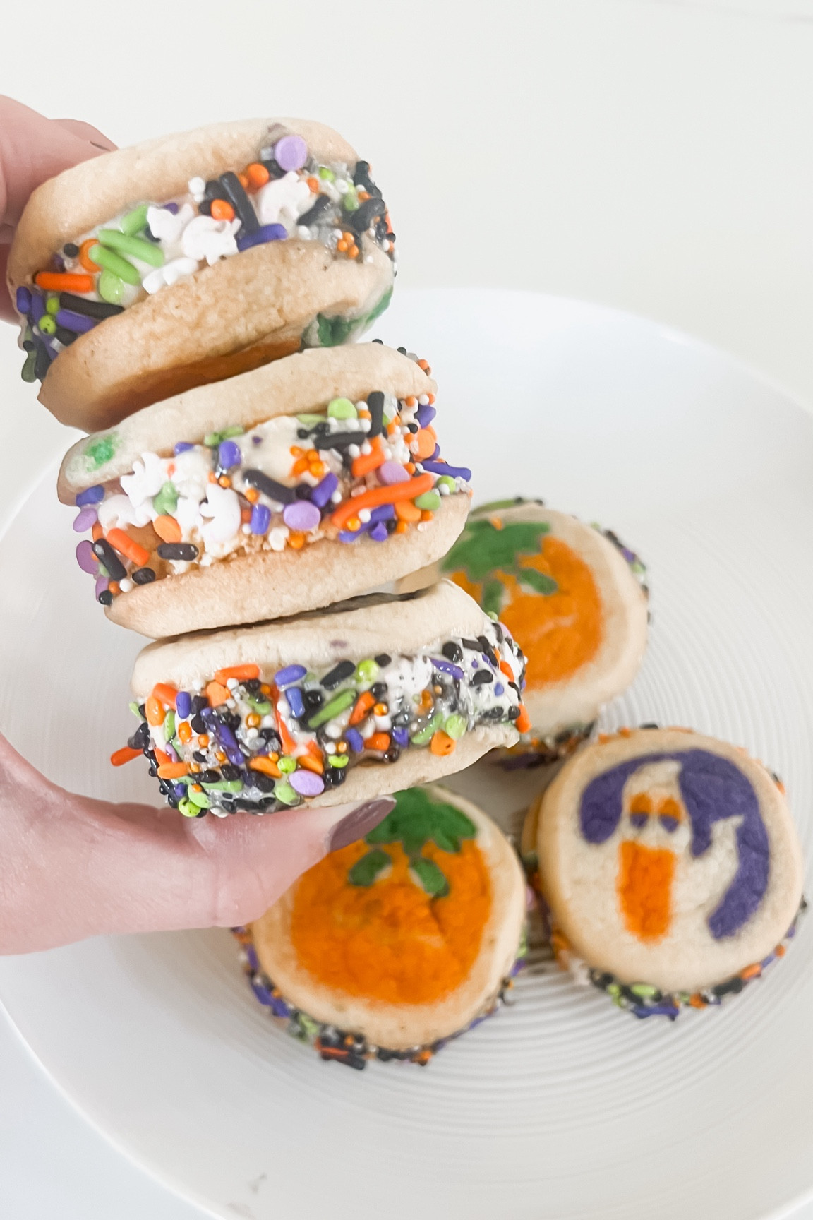 🎃👻I scream, You scream, we all scream for Halloween Ice Cream Sammies!😋🍦Put these on your weekend to do list!!

We used the classic Pillsbury Halloween place and bake cookies in both the ghost and pumpkin design! Bake according to instructions on the box and allow to cool completely. After they have cooled, place a small scoop of ice cream on one cookie and smash it together with another cookie. We did mix and match so each sandwich has a ghost and a pumpkin! if you need to, smooth the ice cream around the edges with your finger and then roll in Halloween sprinkles! After each one, I wrapped in parchment paper and immediately placed in the freezer to avoid melting. You have to work fast or it gets a little messy! The kids loved making these and they loved eating them even more! It’s a super fun Halloween activity with the kids! 

#LTKParties #LTKHalloween #LTKKids