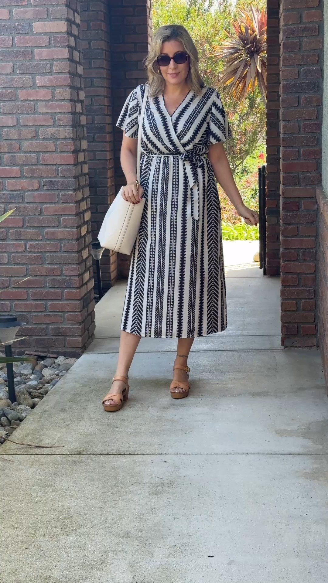 Breezy & Bold in Black and White
This black and white wrap dress is the kind of piece that makes getting dressed feel effortless. The bold print, flattering silhouette, and breathable fabric make it perfect for hot days when you still want to feel pulled together.

I styled it with tan wood helped sandals for a little lift and a structured white tote to keep the look clean and crisp. Definitely one of those go-anywhere, feel-good outfits.

Tags: stylish and grateful, fashionover40, fashionover50, womensfashion, capsulewardrobe, classicwardrobeessentials, summerstyle, wrapdress, effortlesschic, boldprint, wedgeheels, summerdresses


#LTKWatchNow #LTKMidsize #LTKOver40