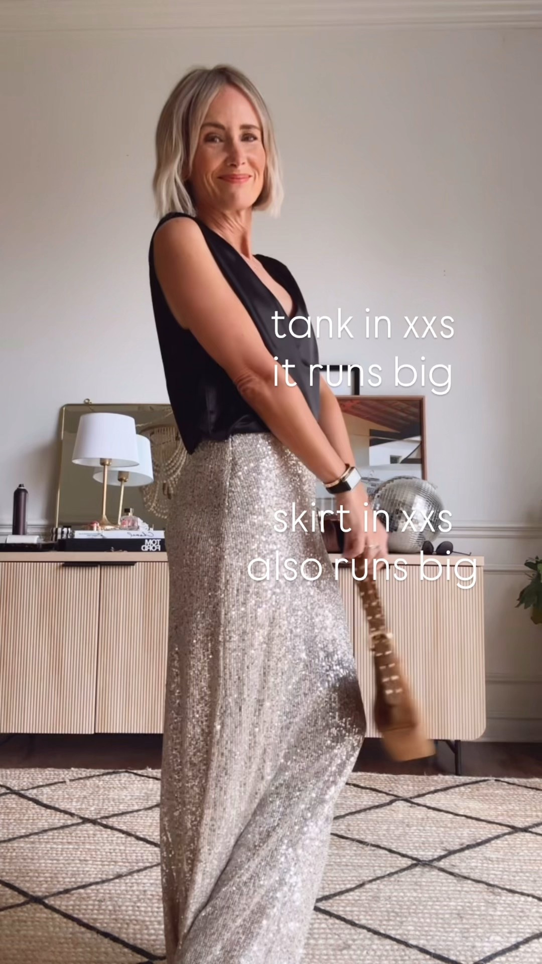 feeling festive!  I love these pieces for a holiday look!  But you can wear this tank with your fave jeans and some boots for a more casual vibe!  
Both pieces run big!  The tank in xxs is
almost still too big for me, but i am small chested.
 Skirt in xxs is perfect!

#LTKHoliday #LTKOver40 #LTKStyleTip