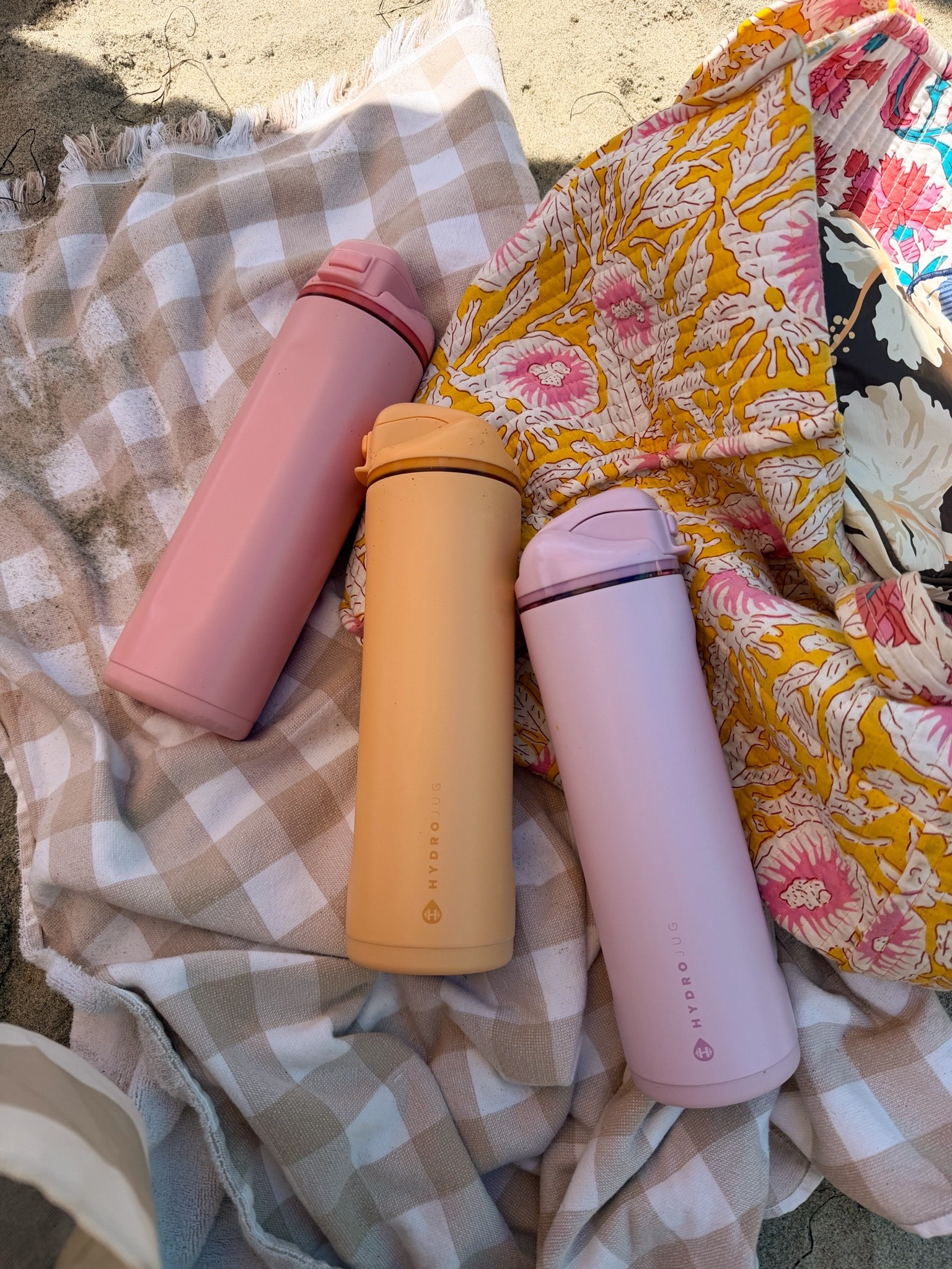 The best water bottles for a beach day with the fam!! @hydrojug #ad