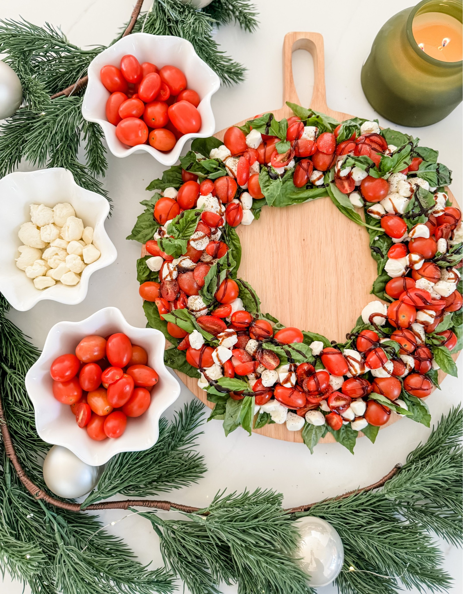 Holiday hosting made easy with @Walmart! #WalmartPartner #IYWYK Are you hosting a holiday gathering this season? Whether big or small, Walmart has all the essentials you need for an easy gathering of family and friends. I created this caprese salad wreath that  turned out so well! I used a charcuterie board for the base then created the dish with small mozzarella balls, little tomatoes and basil leaves! I also added some spinach as the bottom layer for extra green filler. An easy hosting idea to replicate!

#LTKparties #LTKHoliday #LTKSeasonal