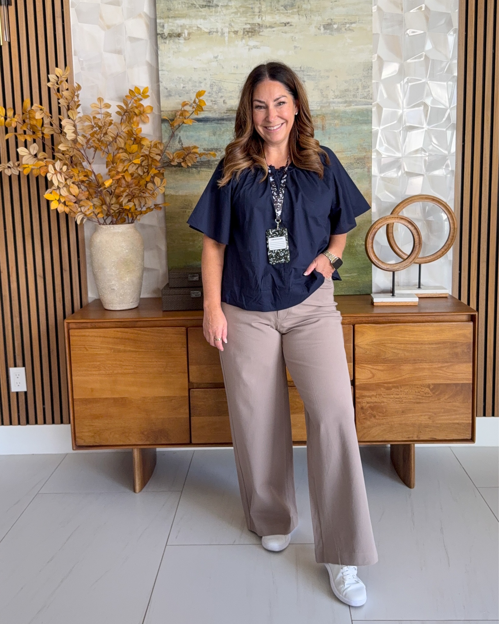 Fall workwear outfit idea 🤎 @oldnavy Navy flutter-sleeve poplin blouse with grey wide-leg trousers, finished with white sneakers. A comfortable, polished teacher outfit and back-to-school casual look.

Sizing: Pants run small wearing 12, need 14 , top tts, L

#LTKOver40 #LTKMidsize #LTKWorkwear