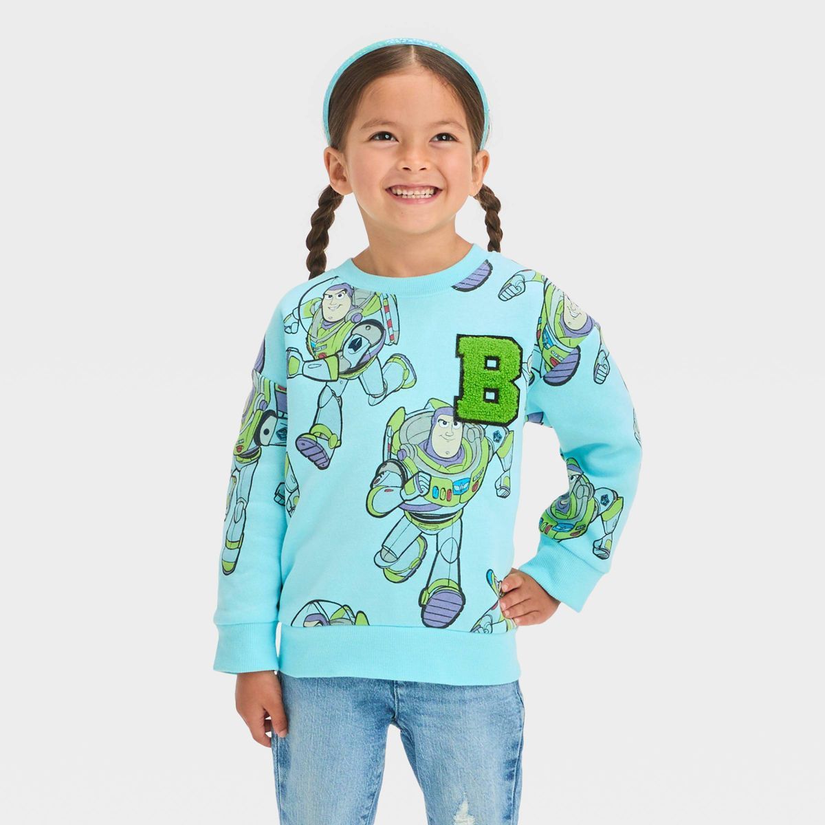 Toddler Girls' Disney Toy Story Buzz Fleece Pullover Sweatshirt - Blue | Target