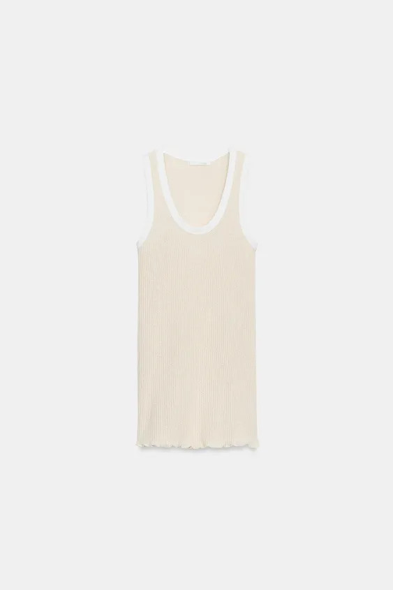 Model height: 178 cmTop crafted from a cotton-blend yarn. Features a round neckline, sleeveless d... | Zara UK