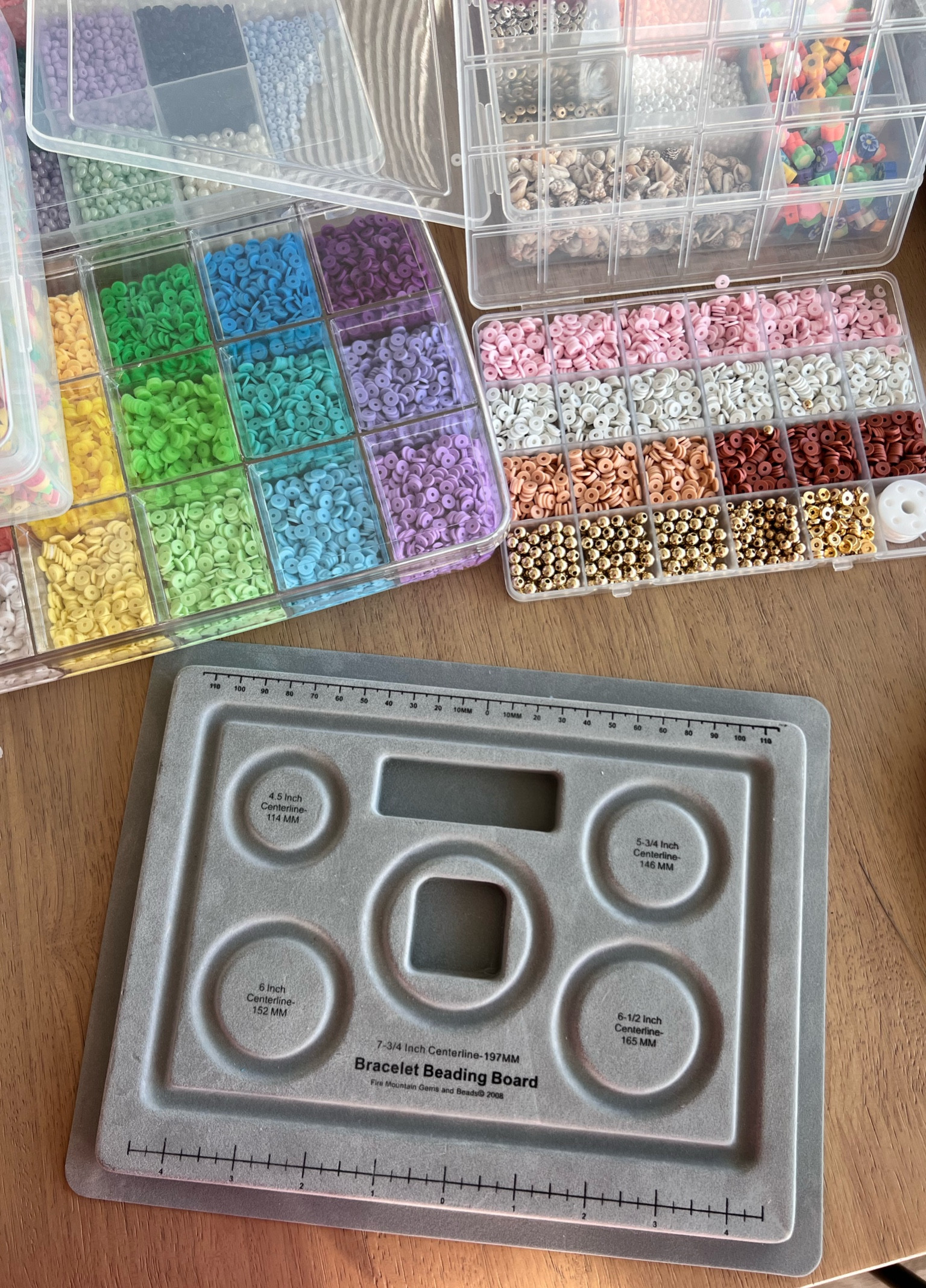 A bracelet beading board is a tool to help you organize and design your bead bracelets. It has grooves and sections to arrange beads, making the beading process easier and more precise!! 
