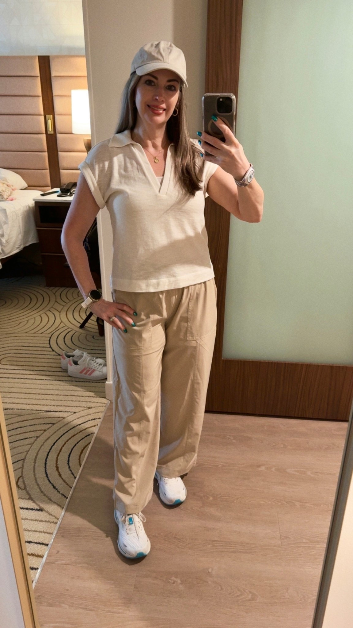 Magic Kingdom day called for some layers and waterproof pants. I’ve got a pair of Palmer shorts underneath my LOFT Wanderweave pants. These have those great zippers at the bottom so I can quickly take my pants off when it gets warmer.
A lightweight top with a cami underneath is a stylish way to layer. No need to remove the top layer, but I could if I wanted to.

Not shown in the picture, but definitely something I highly recommend, the backpack that I tagged. It was recommended in many travel groups, and I’ve gotten a lot of use of it on our trips. It has an inside insulated pocket to put your water in and it’s extremely roomy for putting those extras you’ll need during the changing seasons.
Tip: Bring a lightweight rain jacket, because you never know what Florida weather you'll encounter this time of year. It’s perfect for Tatiana‘s Bayou ride as well if you're going early in the morning and want to avoid walking around the park wet and cold. 

#LTKTravel #LTKPetite #LTKootd