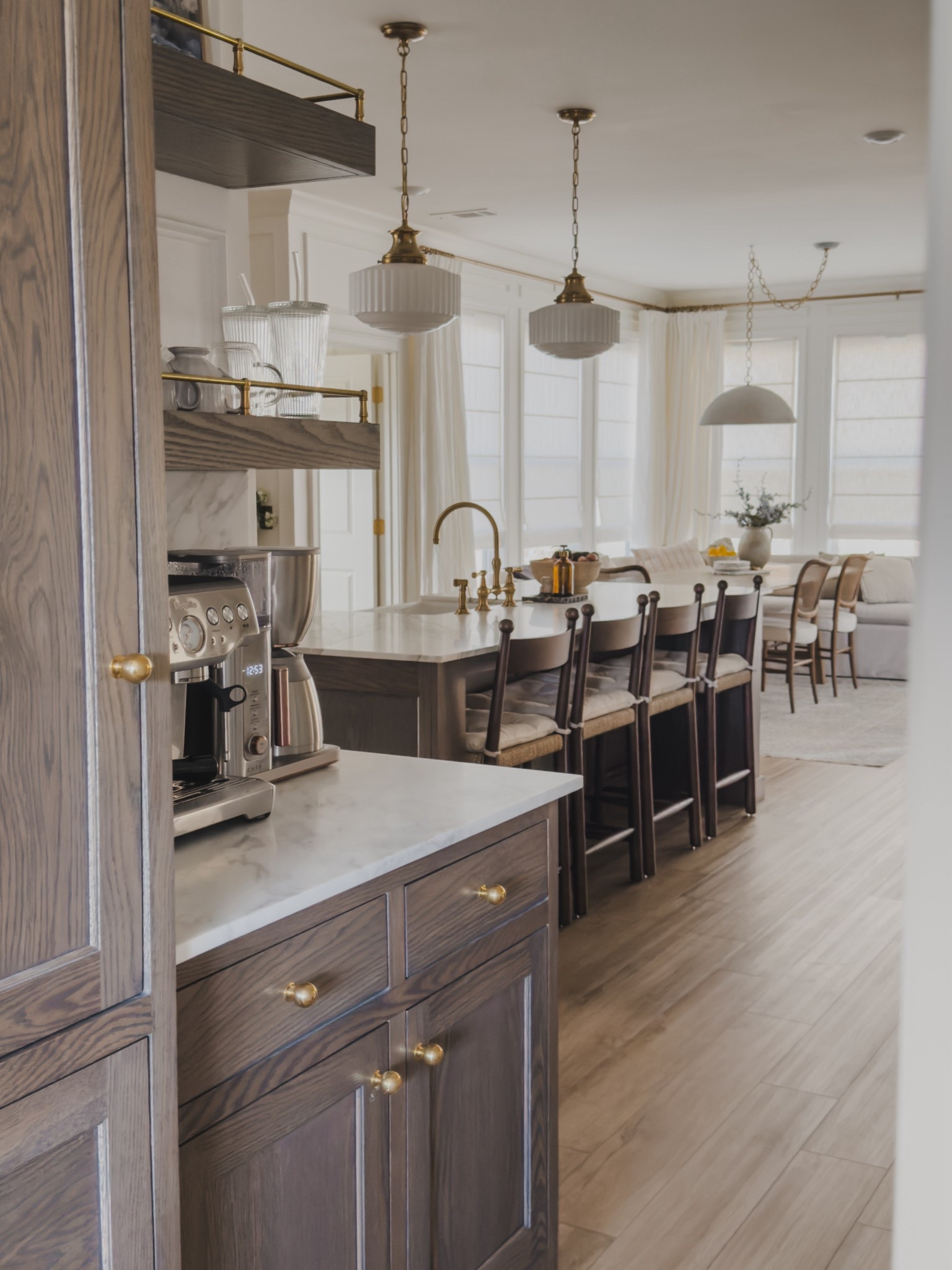 Coffee bar views looking into the kitchen! Love having this space that we utilize multiple times a day and still flows with the rest of the home. For me, it’s all about functionality and design!

Home finds, neutral home inspo, coffee bar views, kitchen views, open concept living, spring refresh, bright and airy, rich wood tones, kitchen island details, counter stool, pendant lighting, breakfast nook, linen curtain, roman shades, neutral area rug, espresso machine, brass accents, unlacquered brass, Visual Comfort, Pottery Barn style, Breville, Rejuvenation, Arhaus, Home and Kids Co, found it on Amazon, Etsy, Wayfair, shop the look!

#LTKSeasonal #LTKHome