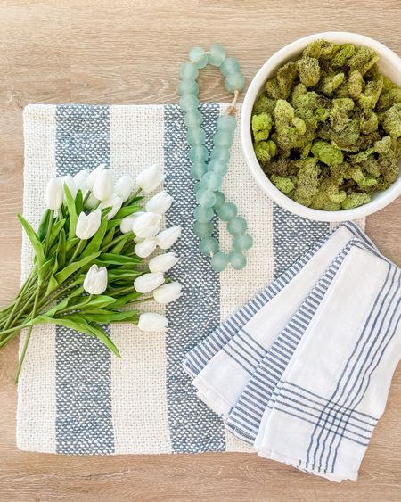 Fun spring decor including woven striped pillows, kitchen towels, my favorite faux tulips, recycled glass beads, and a large ceramic bowl filled with moss.

  spring decorating ideas, coastal decor 

#ltkhome #ltkstyletip #ltkseasonal #ltksalealert #ltkfindsunder100  #ltkfindsunder50

#LTKSeasonal #LTKsalealert #LTKhome