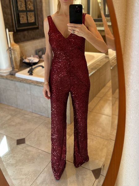 My red sequin jumpsuit is so perfect for Galentine's day festivities! It's comfortable and not scratchy like some sequin outfits. Available all sizes, fits true to size, also it is a great length because it works on taller girls, and is very easily and invisibly hemmed for the more petite ladies. It's also available in other colors.
•
•
•
#Party #gala #DateNight #Valentines #valentinesday #red #outfits #BellBottom #BootCut 

#LTKfindsunder50 #LTKSeasonal #LTKsalealert