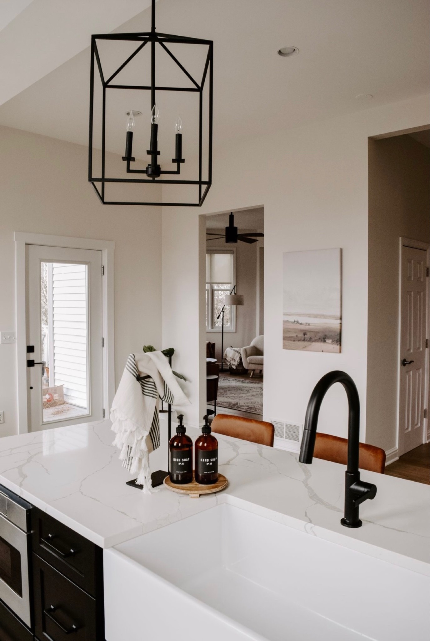 Farmhouse sink kitchen island large lights black faucet soap dispensers modern neutral decor



#LTKhome #LTKstyletip #LTKunder100