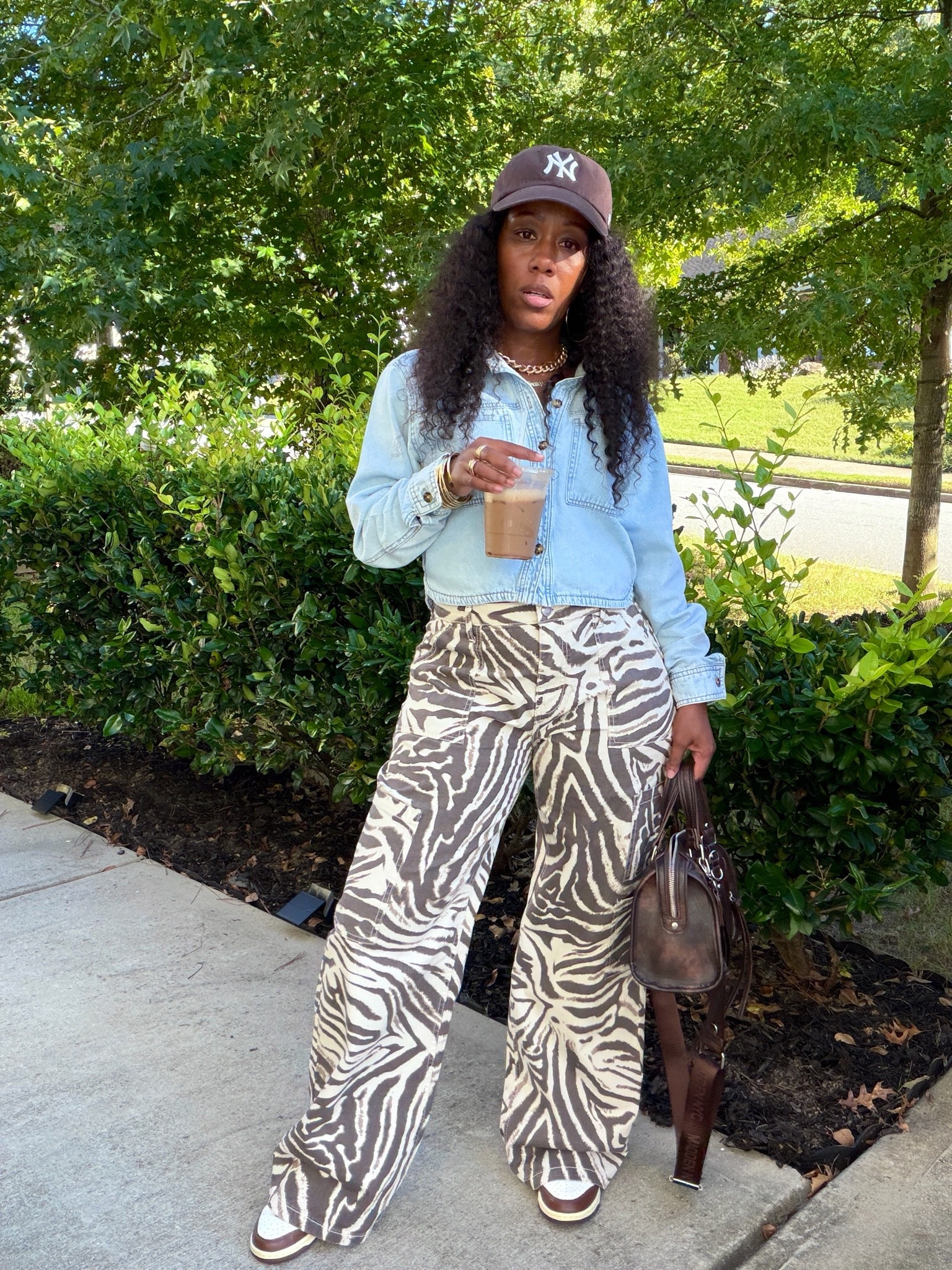 I styled these zebra print wide leg cargo pants with a light wash denim shirt, brown sneakers, and neutral accessories for an easy casual outfit.

#LTKootd #LTKPetite #LTKOver40