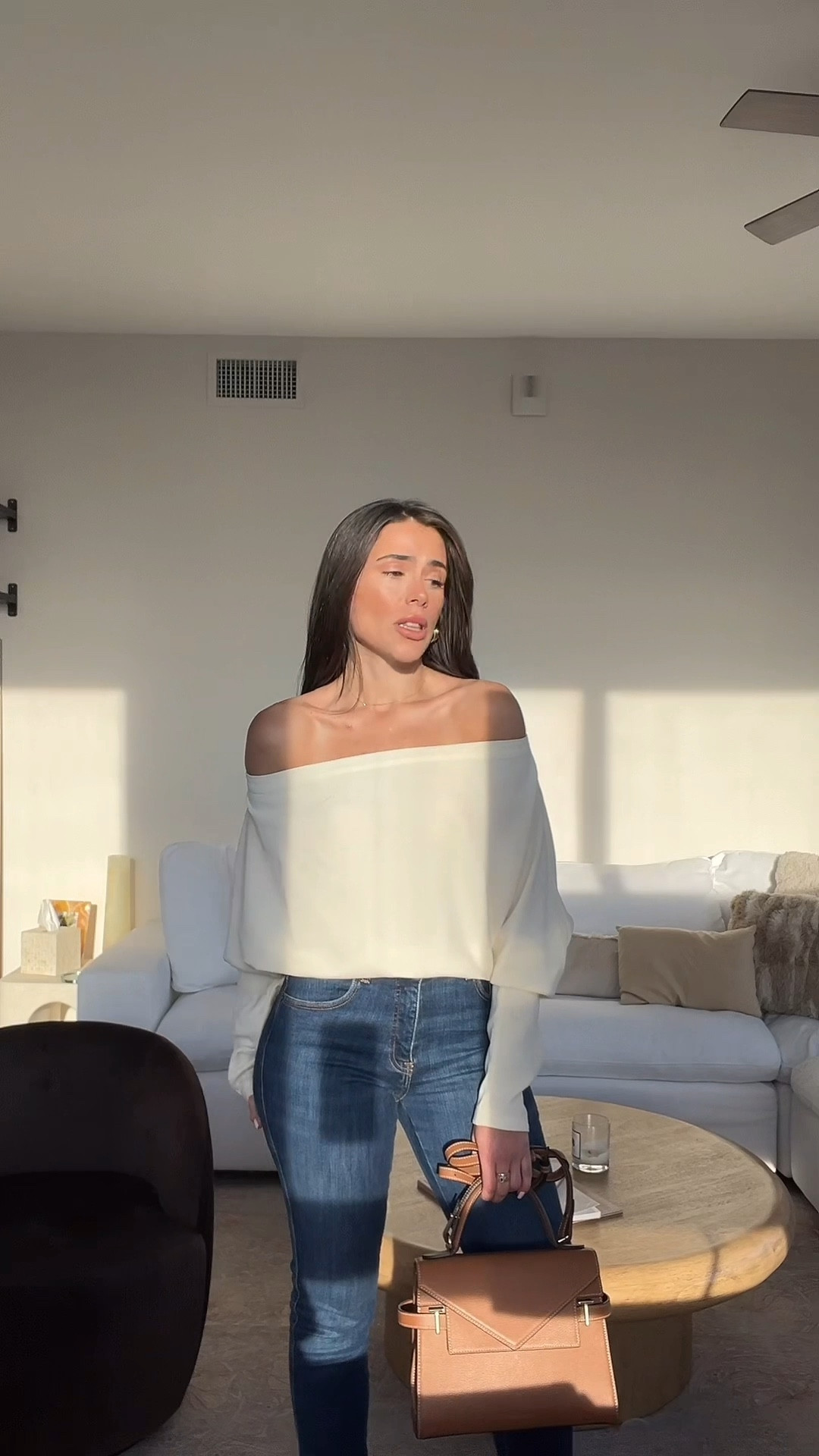 Off the shoulder long sleeve top with skinny jeans. Thin Brown belt. Brown classy medium size purse. Date outfit. Happy hour outfit. 

#LTKFamily #LTKItBag #LTKStyleTip