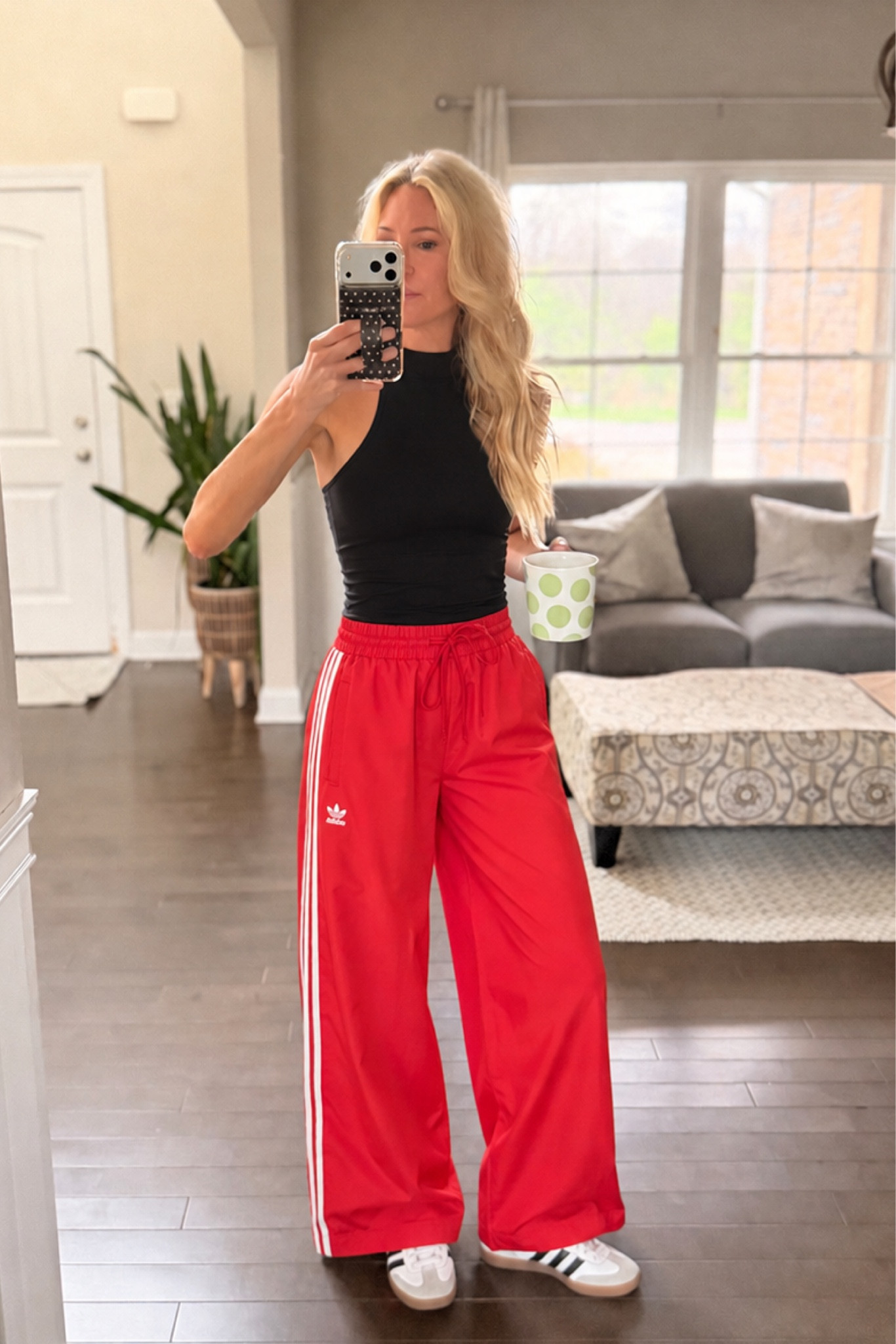 Cute and sporty every day outfit for a mom on the go! 
￼ Red Adidas, track pants and fitted black top perfect for running errands. #adidas #trackpants #sportsmom #casualoutfit #over40

#LTKootd #LTKActive #LTKOver40