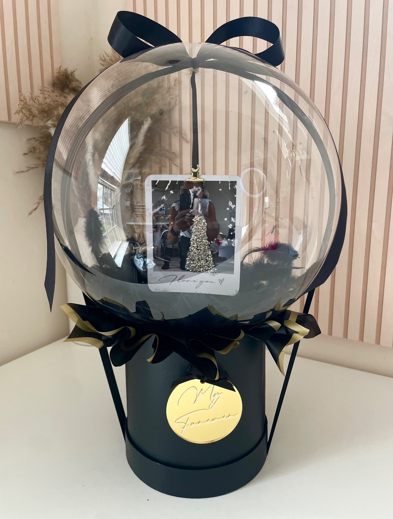 A stunning Valentine’s Day add on that feels deeply personal and unforgettable. This custom balloon keepsake features a photo detail and elegant presentation, making it a meaningful way to celebrate love. It’s also a beautiful and intimate way to pop the question on Valentine’s Day if you’re looking for something thoughtful and heartfelt without a big production.

#LTKValentine