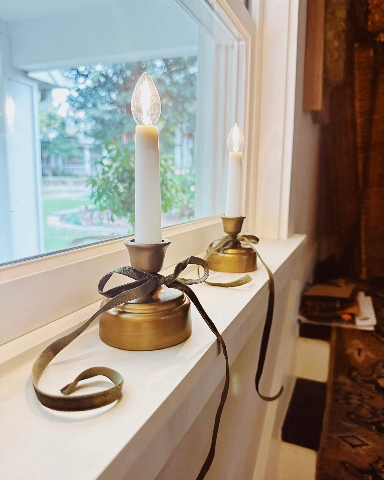 I bought these cute battery operated candlesticks last year at Christmas time.

I love how they looked in my front windows at night, during the holidays.

They are back in stock this year and come with a brass or a wooden base. 

I tied a narrow velvet ribbon just to add a little something to mine.

#LTKSeasonal #LTKHome #LTKFindsUnder50