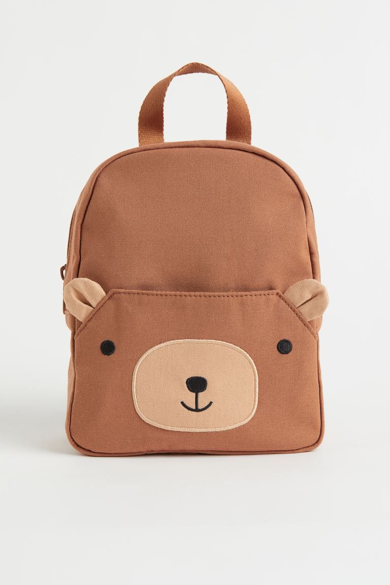 Backpack in woven fabric. Adjustable shoulder straps, handle, and concealed zipper at top. Outer ... | H&M (US + CA)