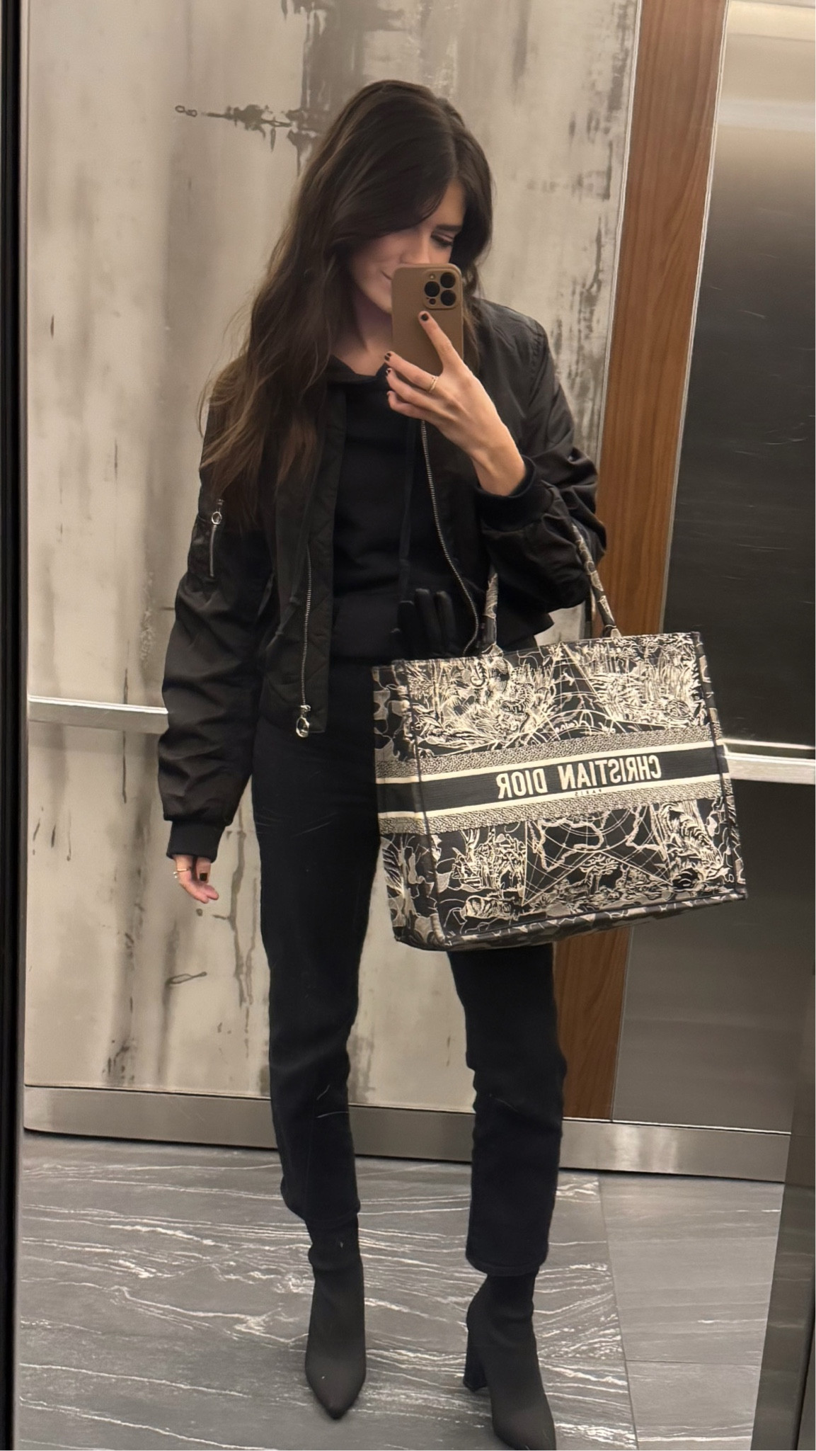 Casual work outfit, dior book tote, moto jacket, bomber jacket, Amazon boots, black hoodie, casual outfit 

#LTKItBag #LTKStyleTip #LTKWorkwear