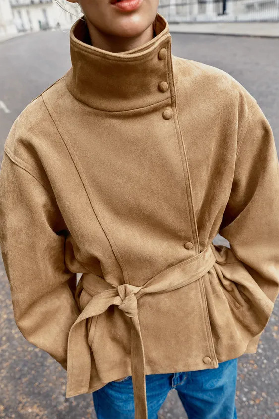 High-neck jacket with long sleeves. Front pockets. Features a matching fabric belt and gathered d... | Zara UK