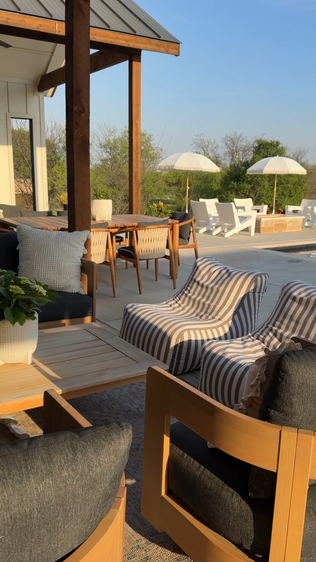 We wanted an outdoor space that felt just as comfortable as inside and this setup delivered. The outdoor sofa + swivel chairs from @Wayfair are so good, and layering in the Loloi Topanga rug makes it feel like a true living space. The striped bean bag chairs are perfect for casual seating and built to last. Add in the outdoor chaise loungers and teak barstools and it’s everything we need for slow mornings and long summer nights.

Keywords: backyard oasis ideas, outdoor living room, Wayfair outdoor furniture, patio seating area, outdoor swivel chairs, Loloi Topanga rug patio, bean bag seating outdoor, weather resistant furniture, fire pit seating, chaise lounge chairs, teak bar seating, poolside decor, outdoor entertaining space 
#wishyouwerehere #outdoor #wayfair #ad #wayfairpartner

#LTKHome #LTKSeasonal #LTKstorytime