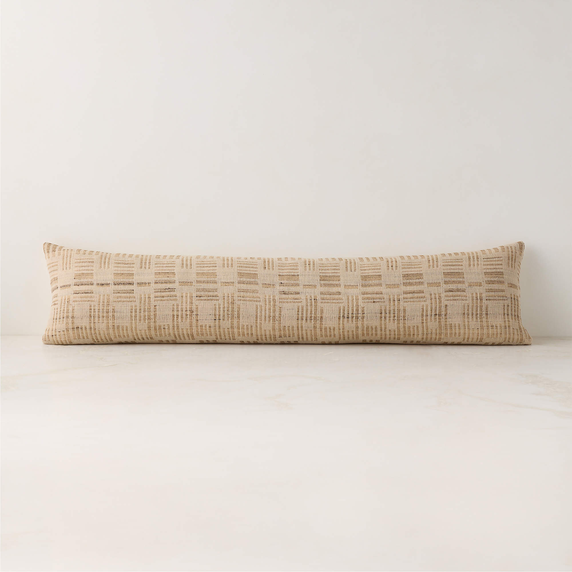 Melrose Sand with Warm White Jacquard Wool and Silk Lumbar Pillow with Feather-Down Insert 48"x12... | CB2