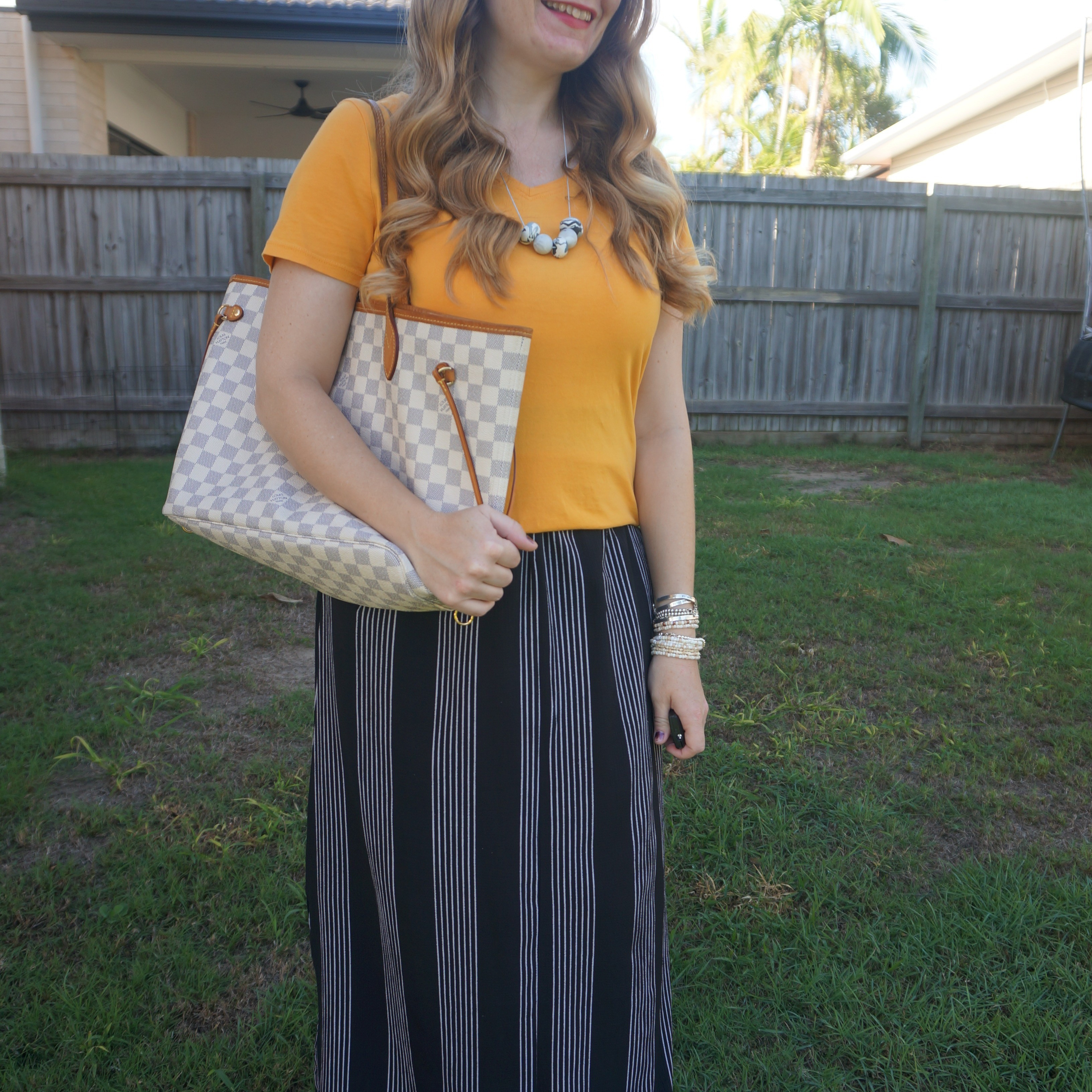Mustard tee with vertical stripe maxi skirt and Louis Vuitton damier azur neverfull tote bag 💛

#LTKaustralia #LTKautumn #LTKbag