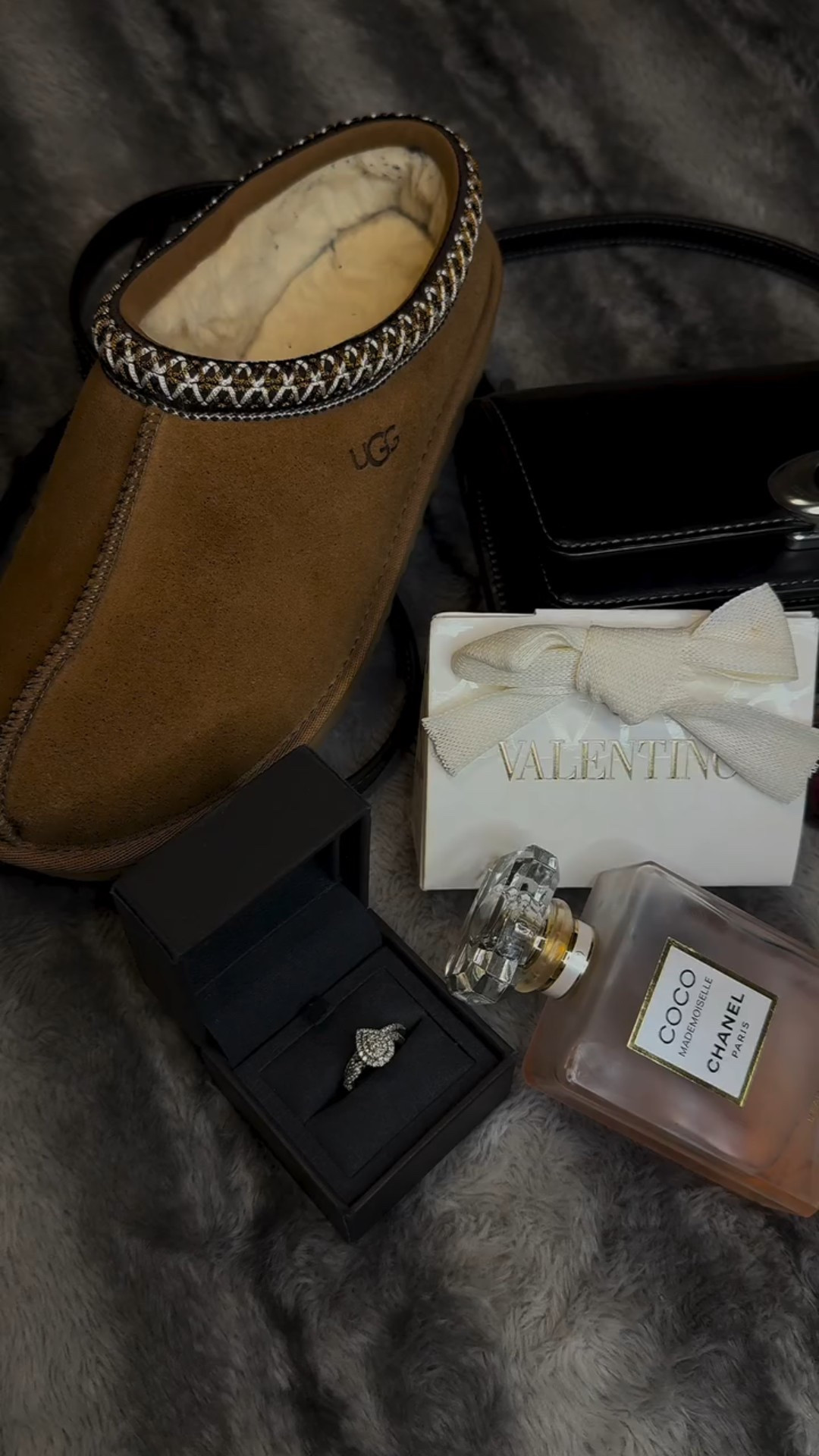 Curated luxury gifts for her — all pieces I personally own, love, and KNOW make perfect holiday gifts 🤍 From cozy UGG slippers and timeless Coco Chanel perfume to my Coach fave, Valentino lip gloss, and of course… a diamond ring. If I love it, she will too. Consider this your soft-life holiday wishlist wrapped in one aesthetic moment. 🎁✨

@ugg 
@coach 
@valentino.beauty @maisonvalentino 
@loccitane 
@chanel.beauty @chanelofficial 
@verawang @verawanggang @verawangbride 

#giftsforher #luxurygiftideas #luxurygiftguide #holiday #uggtasman #coachbag #valentino #chanel #loccitane #verawang #weddingrings

#LTKHoliday #LTKBeauty #LTKGiftGuide