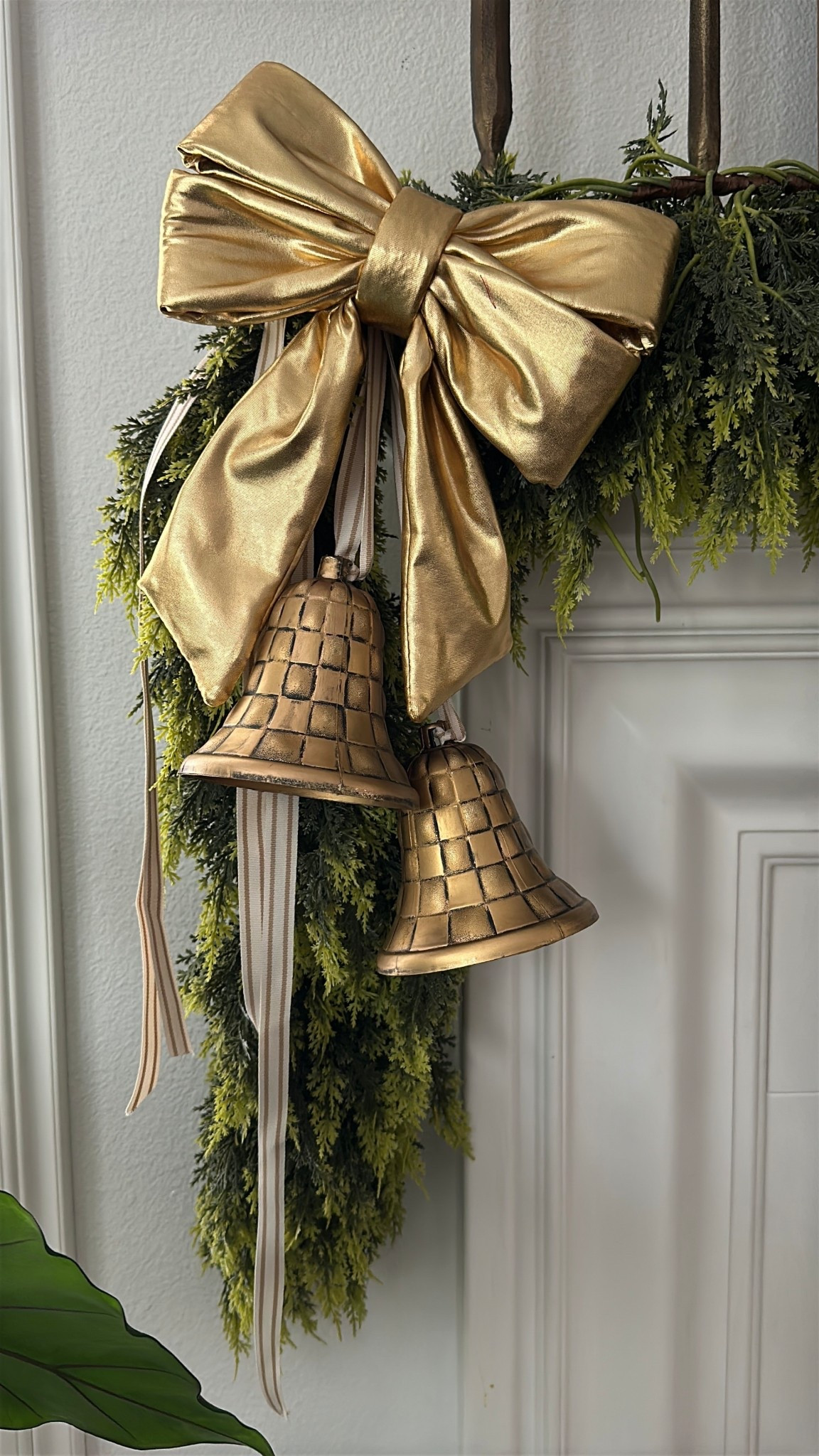 The perfect holiday diy! The brass bells were diy’ed using plastic bells from dollar tree + black spray paint and rub and buff! 

#LTKHoliday #LTKSeasonal #LTKHome