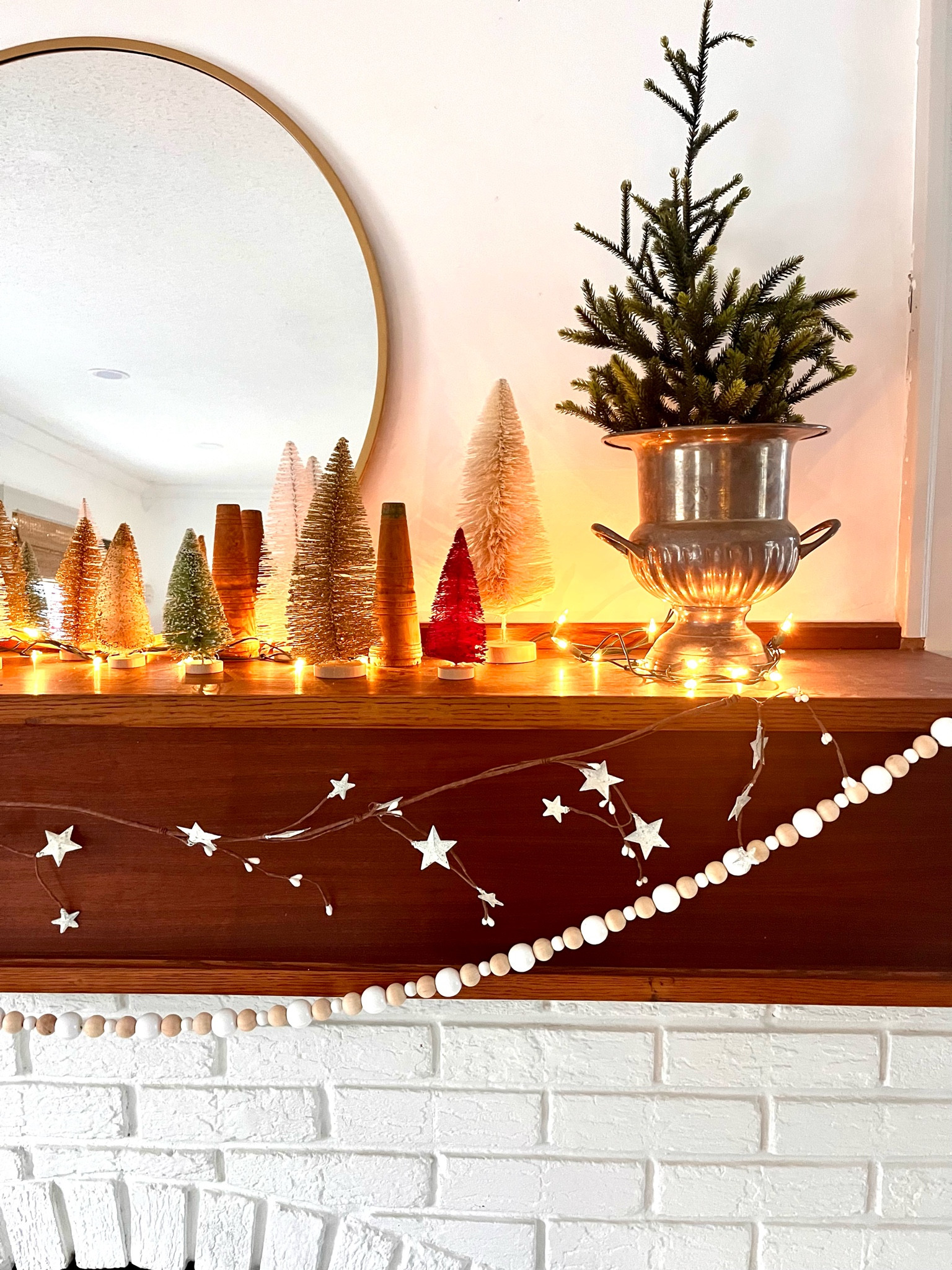 Simple holiday mantel with bottle brush trees 🌲 

#LTKHoliday #LTKHome #LTKSeasonal