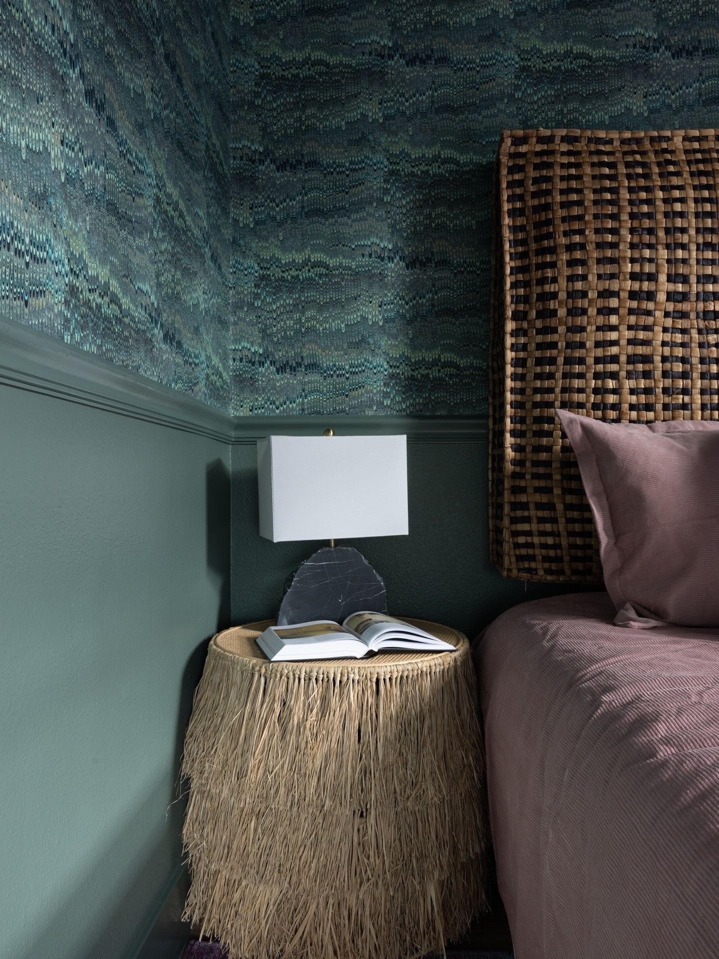 The Collectors Nest Primary Bedroom ✨Layered, textural, and unapologetically rich. Jewel tones against woven textures, sculptural lighting, and a Moroccan floor cushion reimagined as a headboard.
.
Photo by @stillhauscreative 
.
.
.
#boldwallpaper #austintexas #interiordesigner