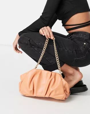 ASOS DESIGN oversized ruched clutch bag in apricot with detachable shoulder chain | ASOS (Global)