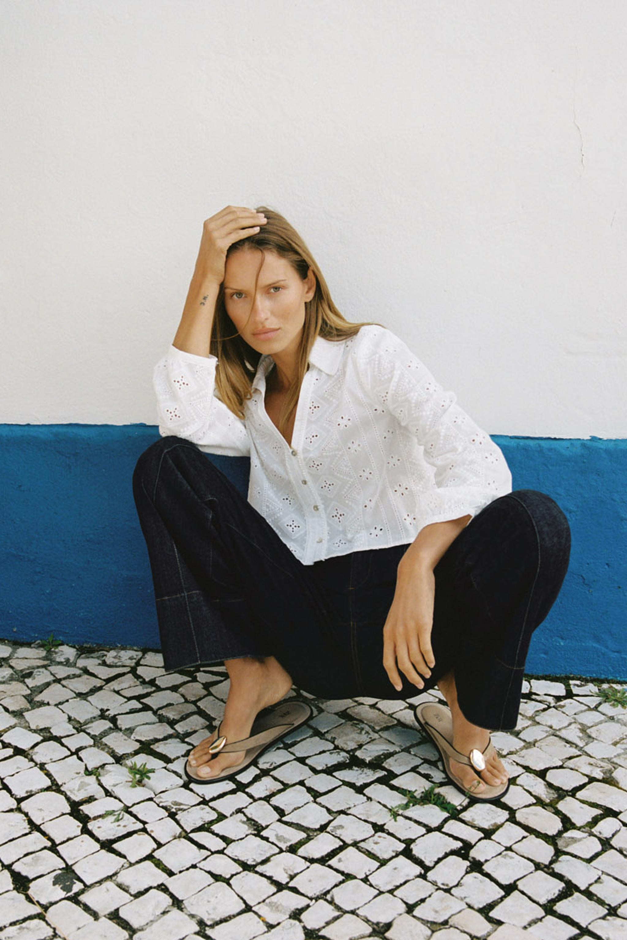 Short shirt with lapel collar, V-neck, and long sleeves. Tonal embroidered eyelet detail. Front b... | Zara US