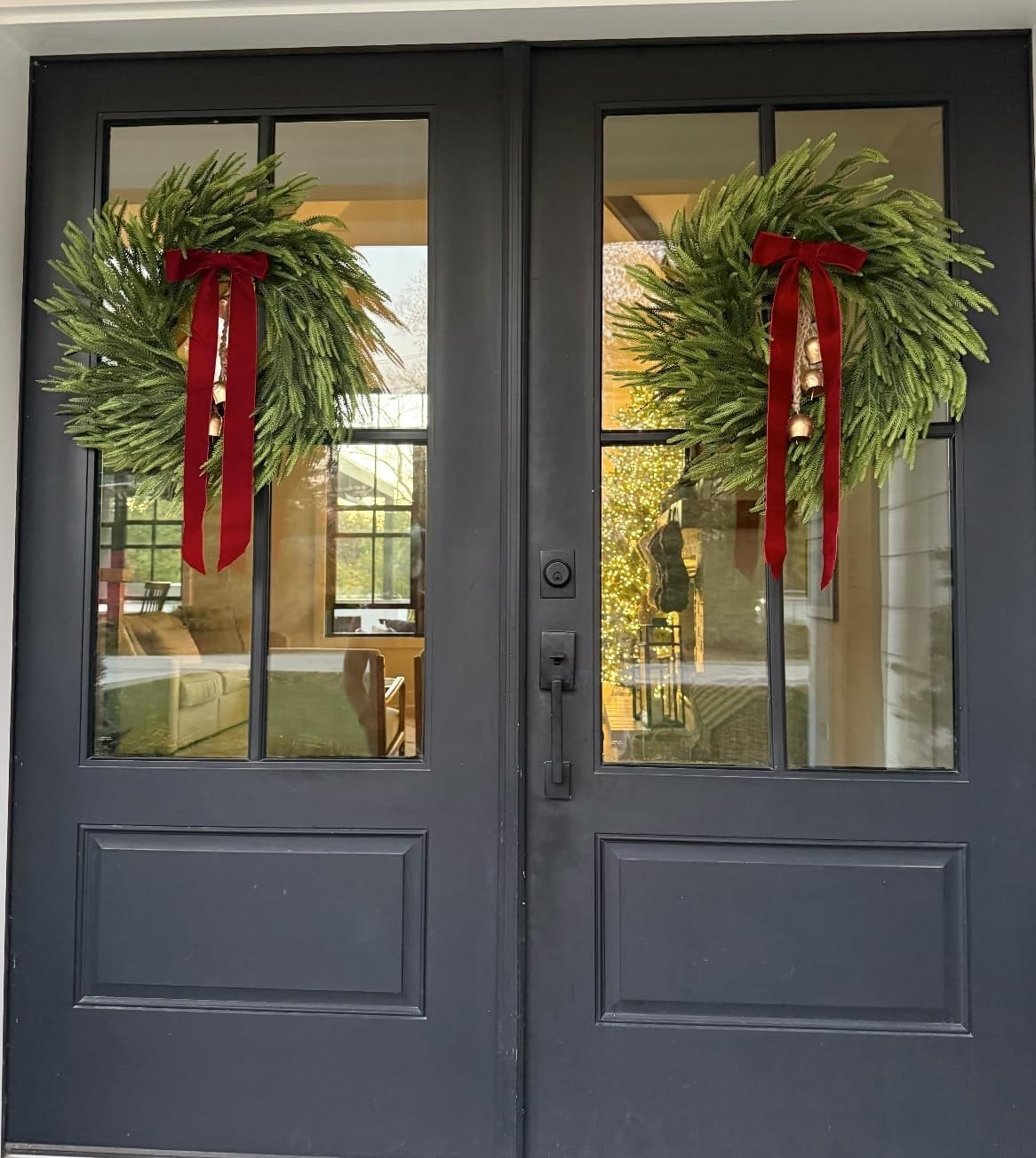 These pine wreaths are so realistic looking and they're a great size too! I added ribbons and bells. I hung them. using the suction cup hooks - so easy!

#LTKSeasonal #LTKHoliday