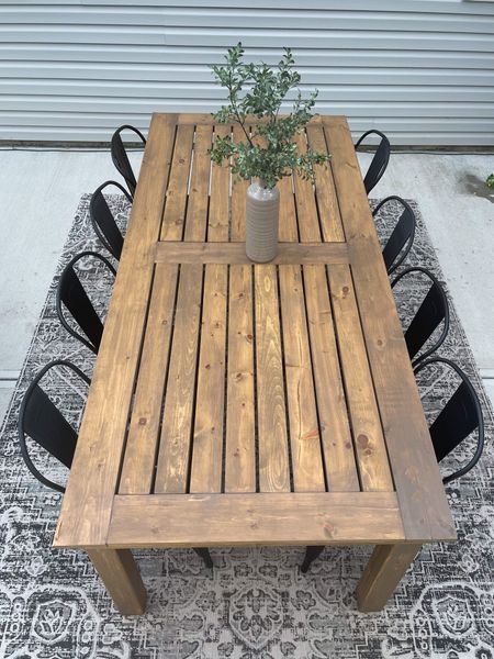 DIY outdoor table, black metal modern farmhouse chairs, wood outdoor table. 
#outdoorspace 
#patiotable
#modernfarmhousetable 

#LTKfamily #LTKhome